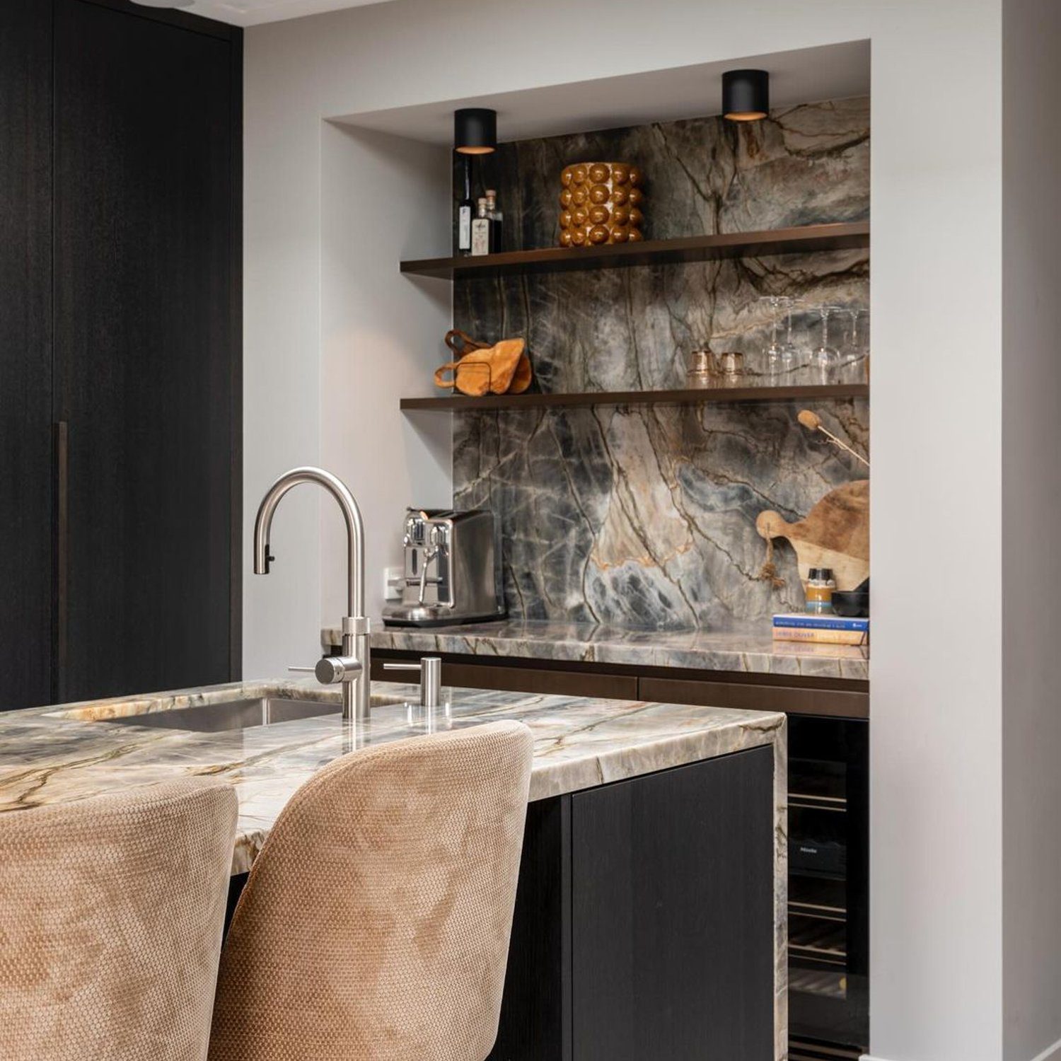 Elegant kitchenette with marbled surfaces