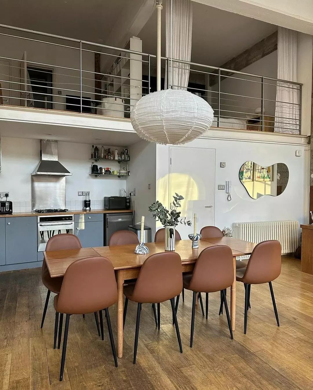 Loft-style dining area with a mezzanine