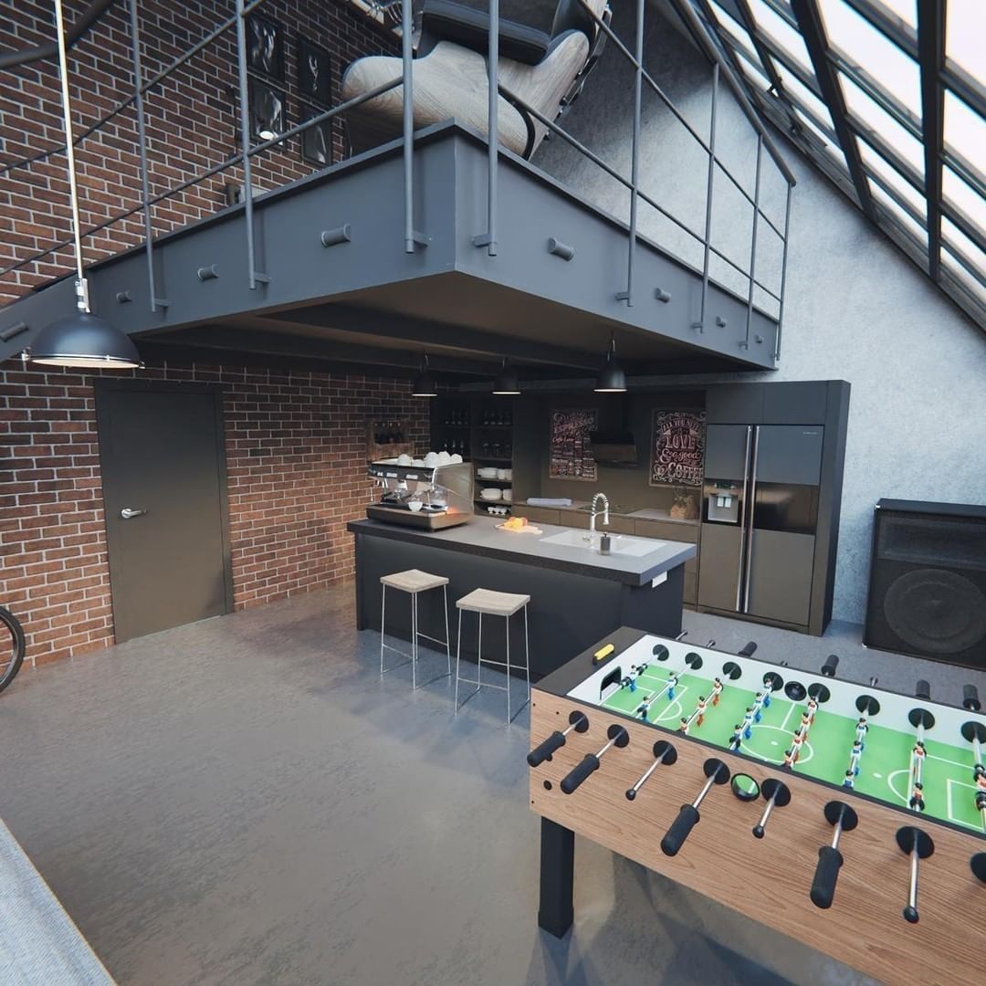 A loft-style kitchen with exposed brick and a foosball table