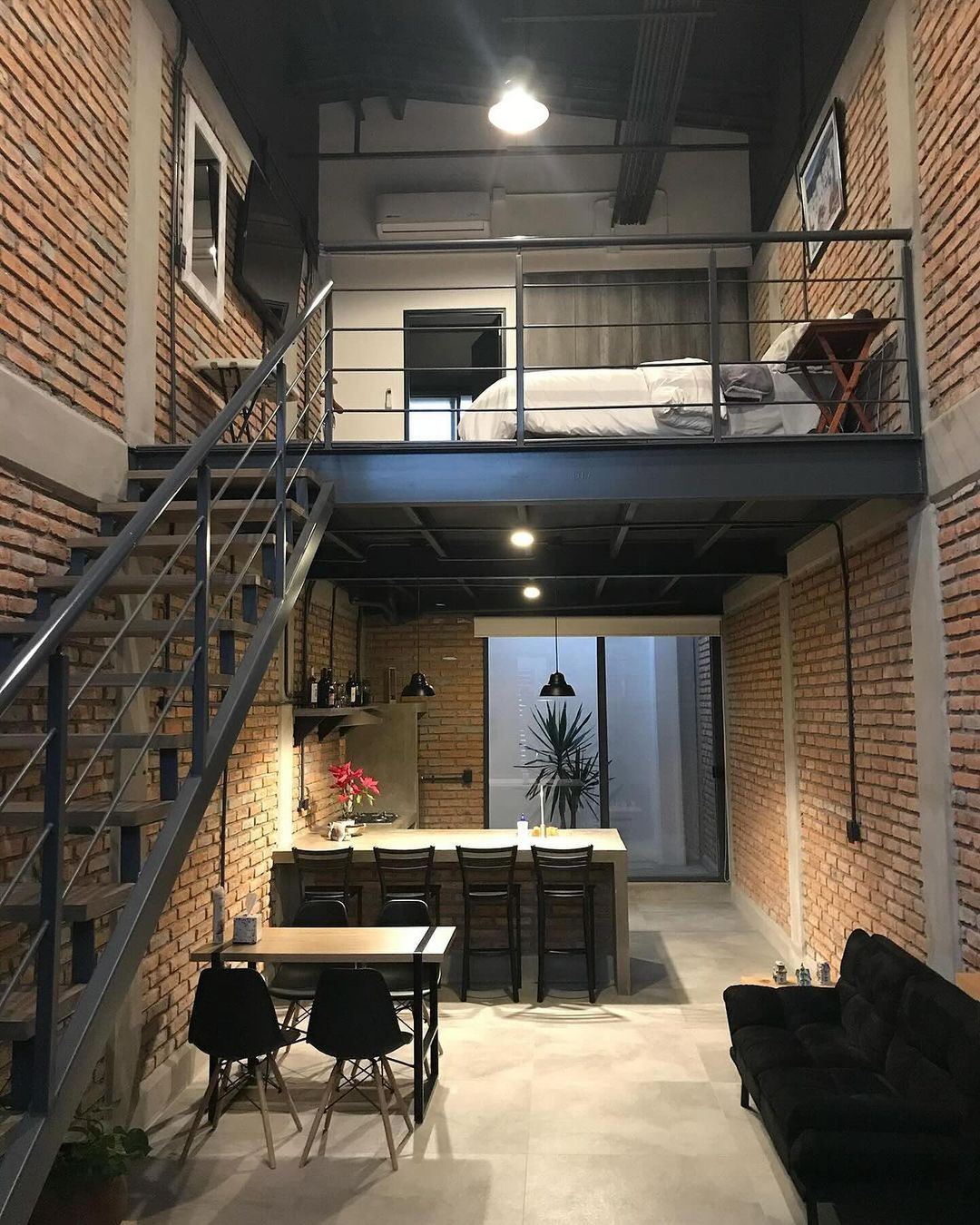 Loft style apartment interior with exposed brick walls