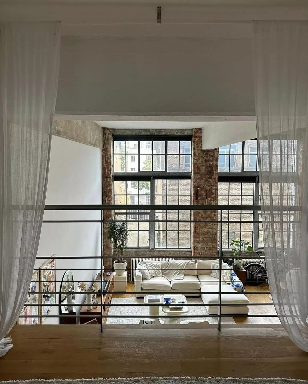 Loft style living area with large windows