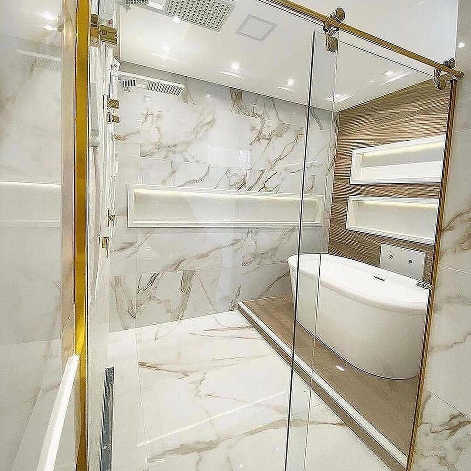 A modern luxurious bathroom featuring marble tiles