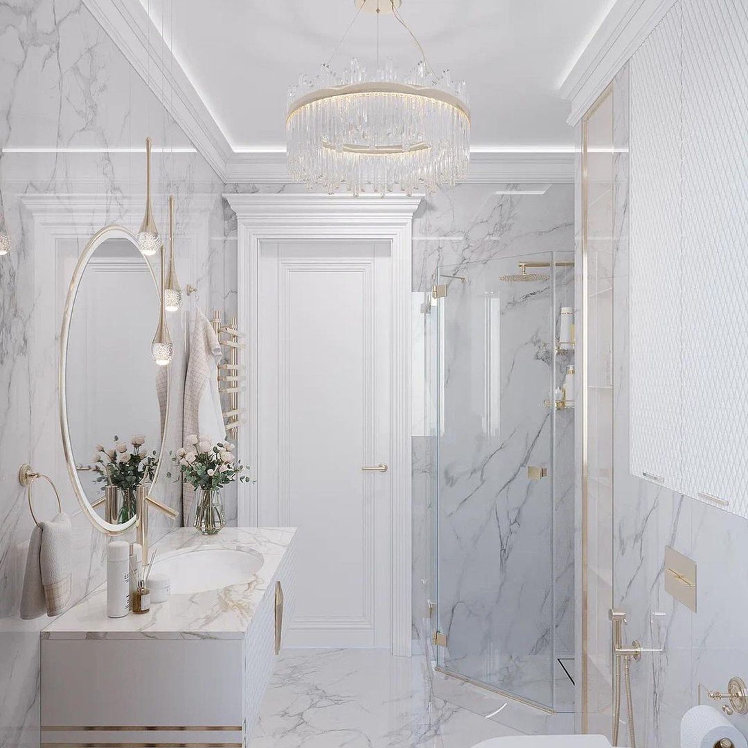 Luxurious marble bathroom with elegant gold accents and a crystal chandelier