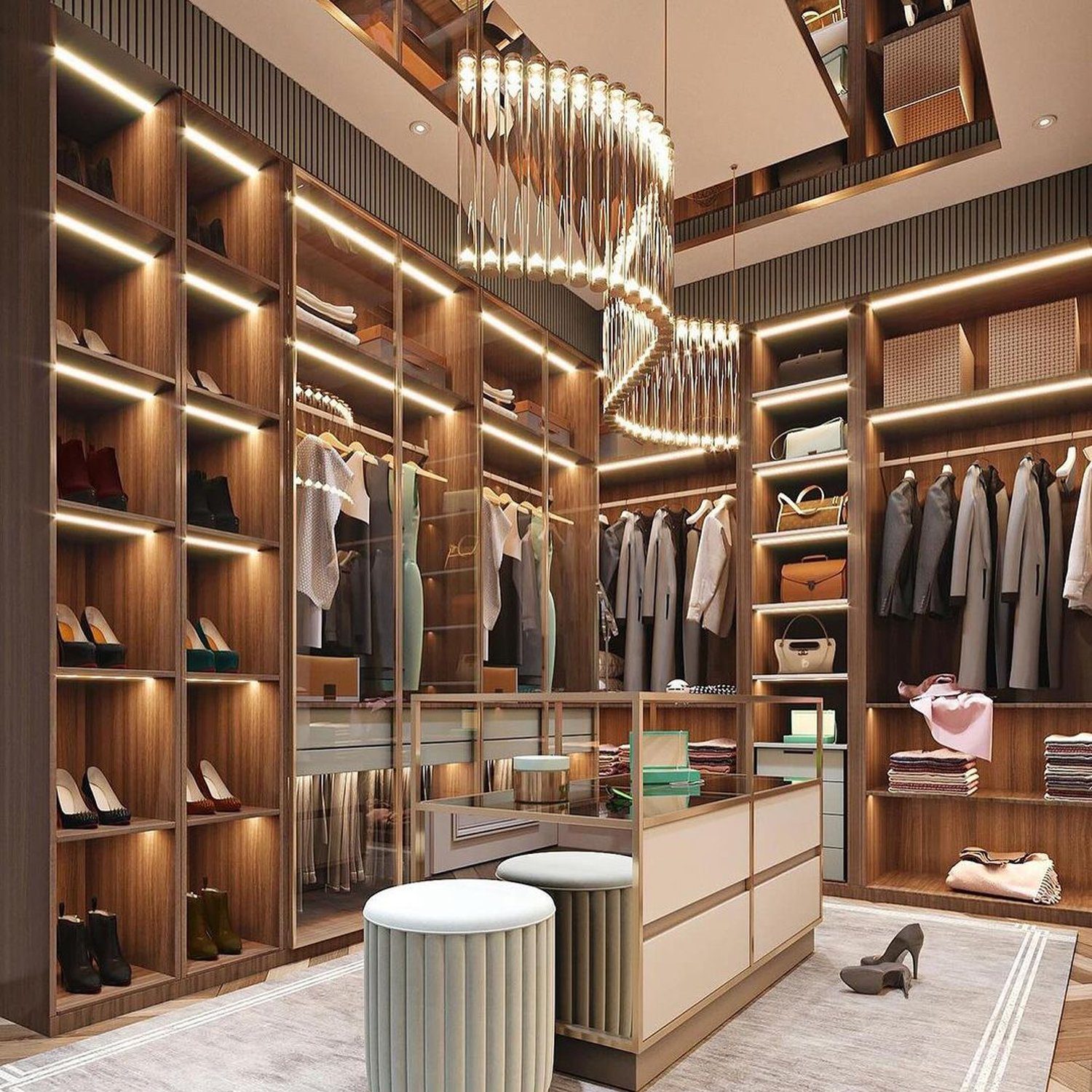 Elegant walk-in closet showcasing illuminated shelves and a luxurious chandelier