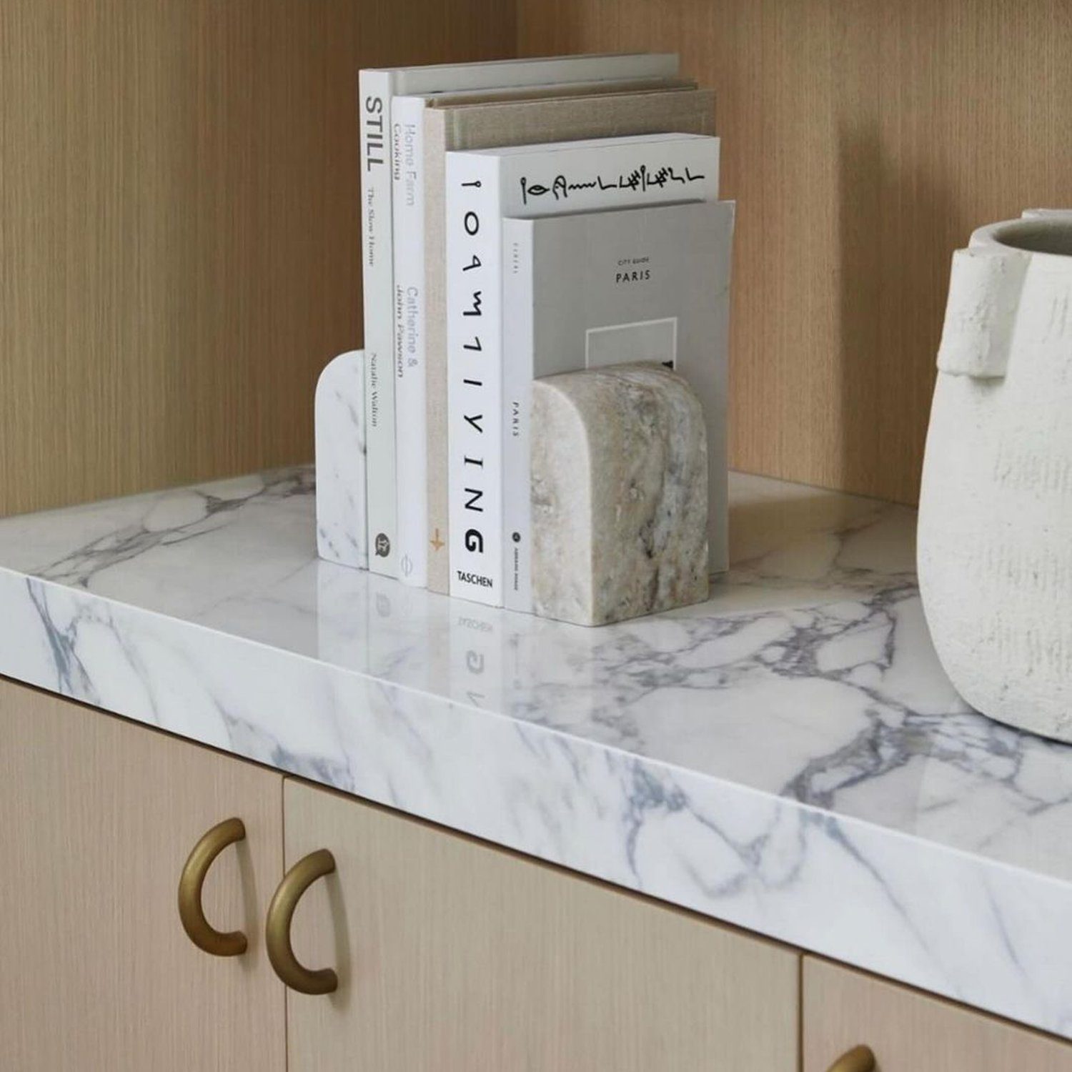 Elegant bookshelf display with marble shelf