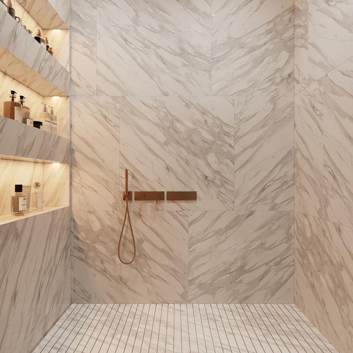 Elegant marble-tiled shower with brushed bronze fixtures