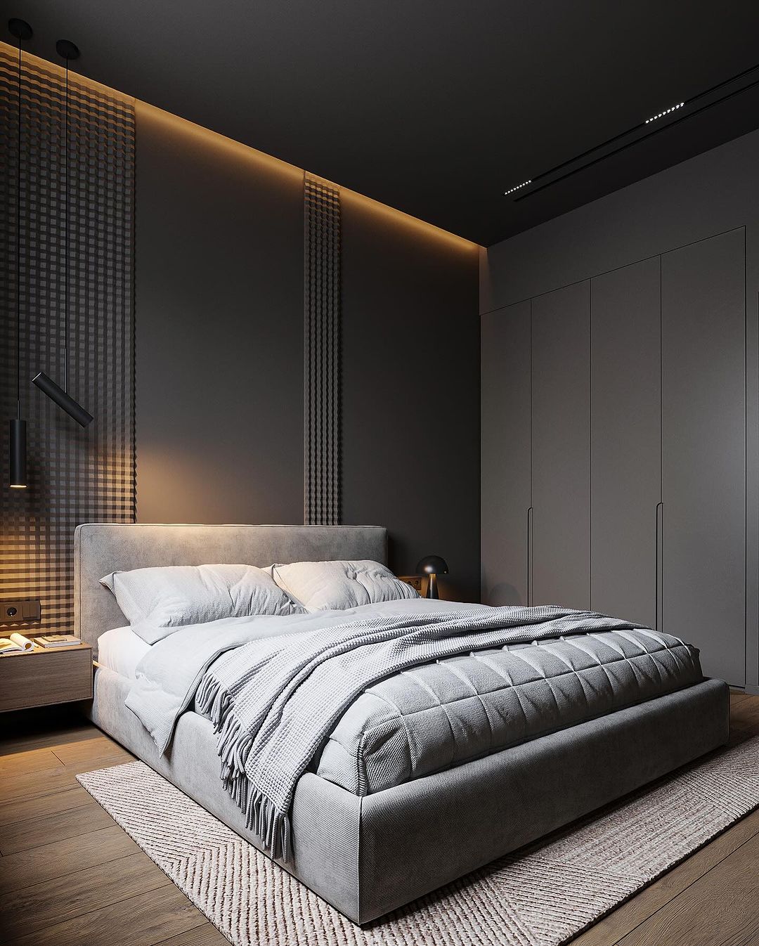 A minimalist bedroom featuring a plush grey bed with a luxurious textured throw blanket and matching pillows