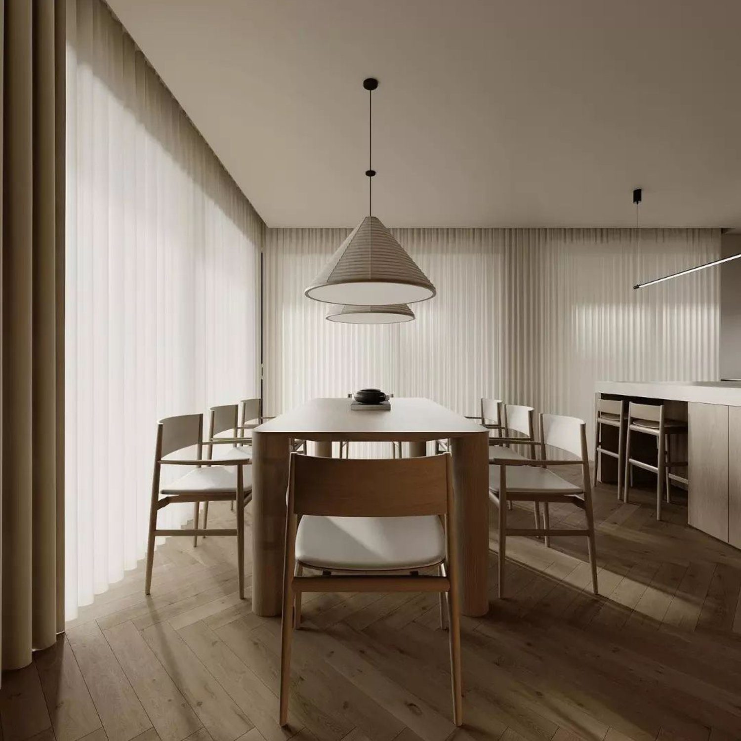 A minimalist dining room with sleek furniture and soft natural light