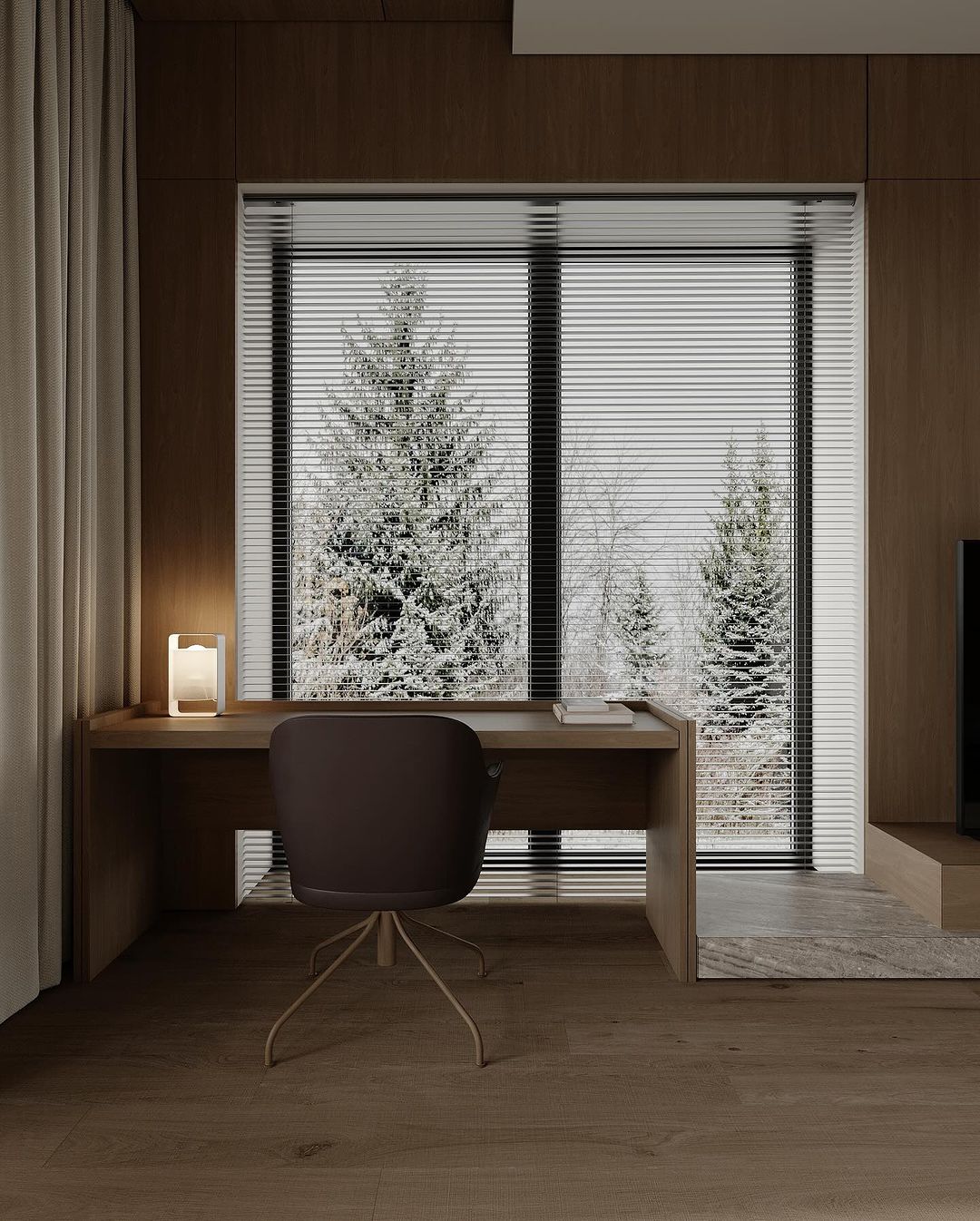 A minimalist workspace with a view of snow-covered trees