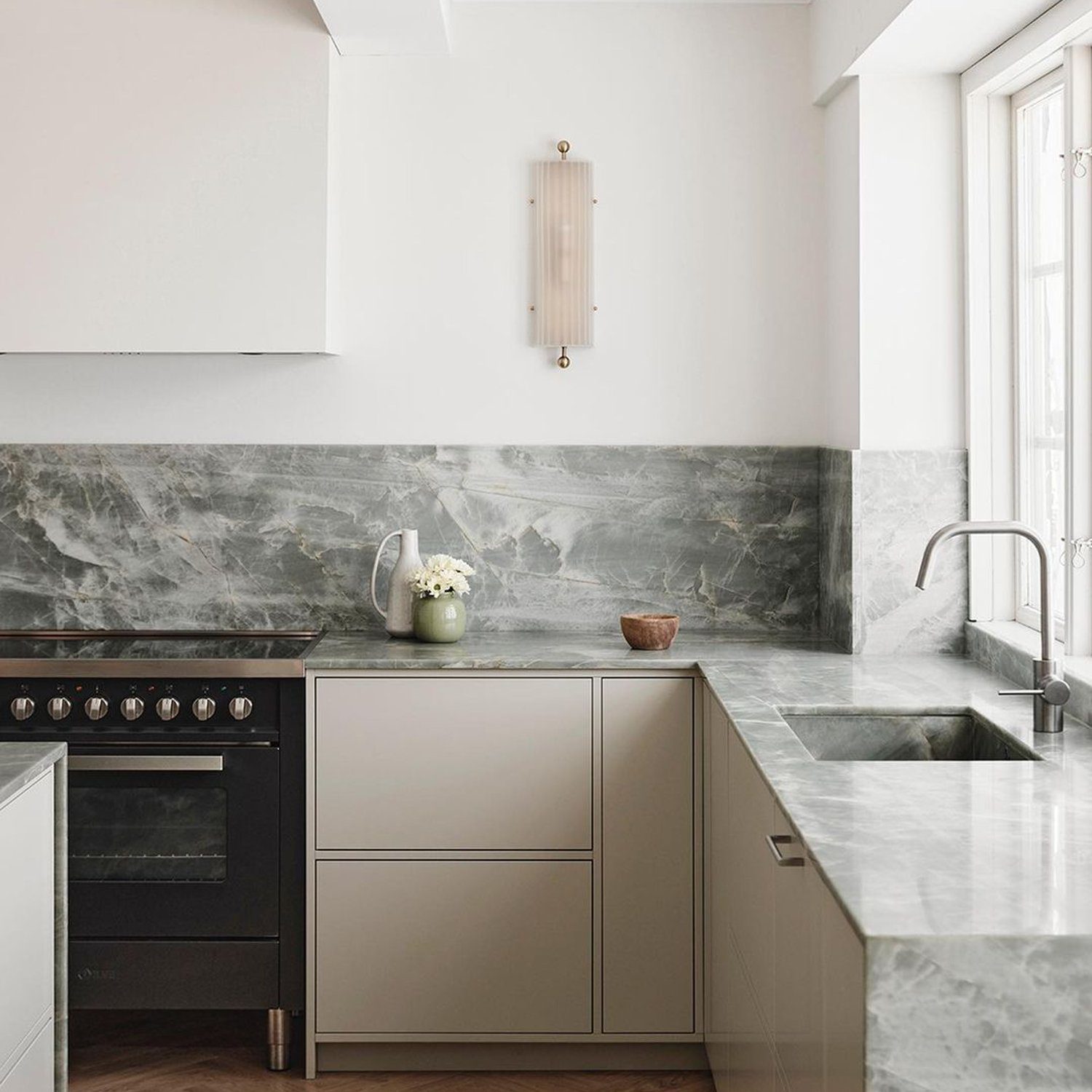 Elegant marble kitchen with herringbone floor