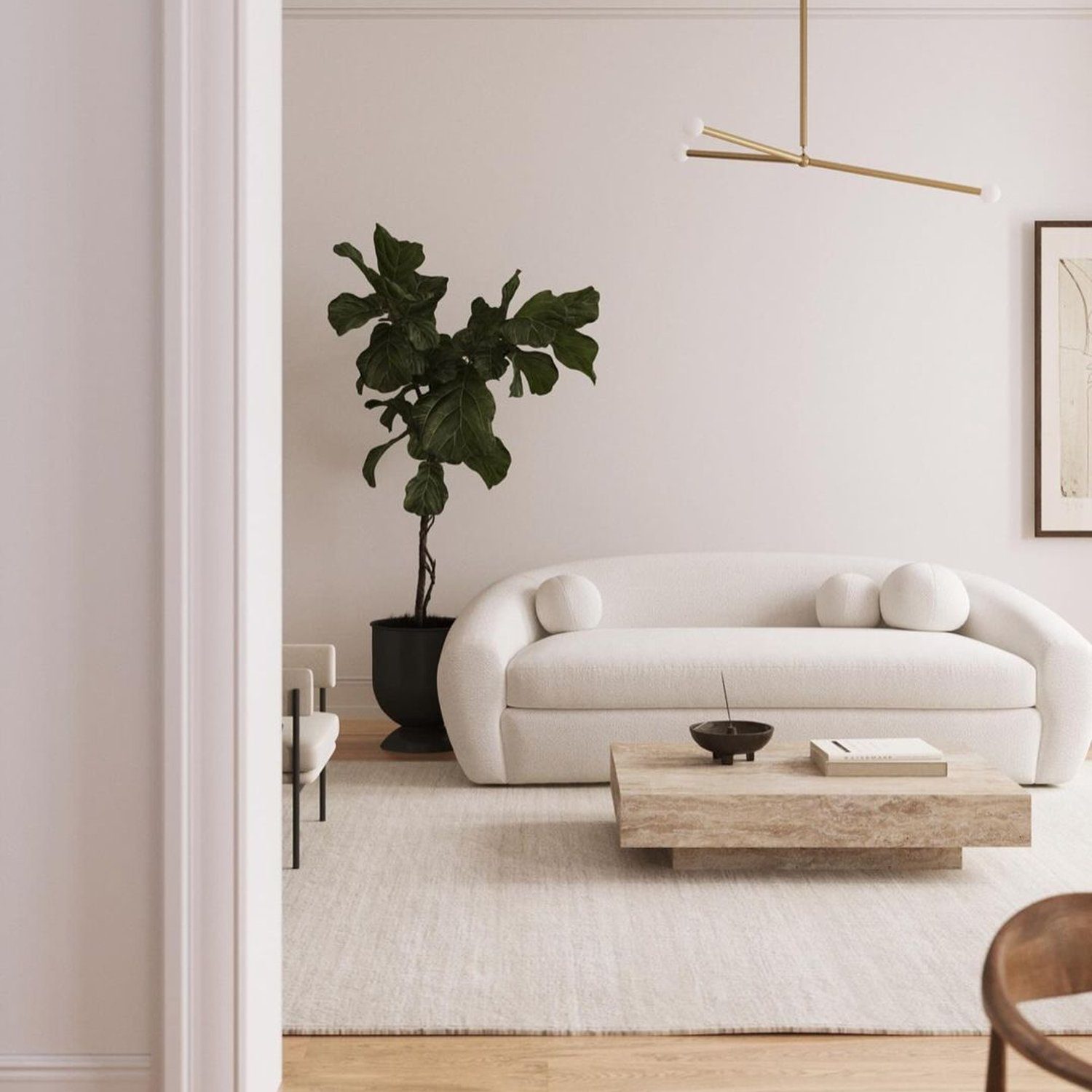 A tastefully minimalist living room with a touch of greenery