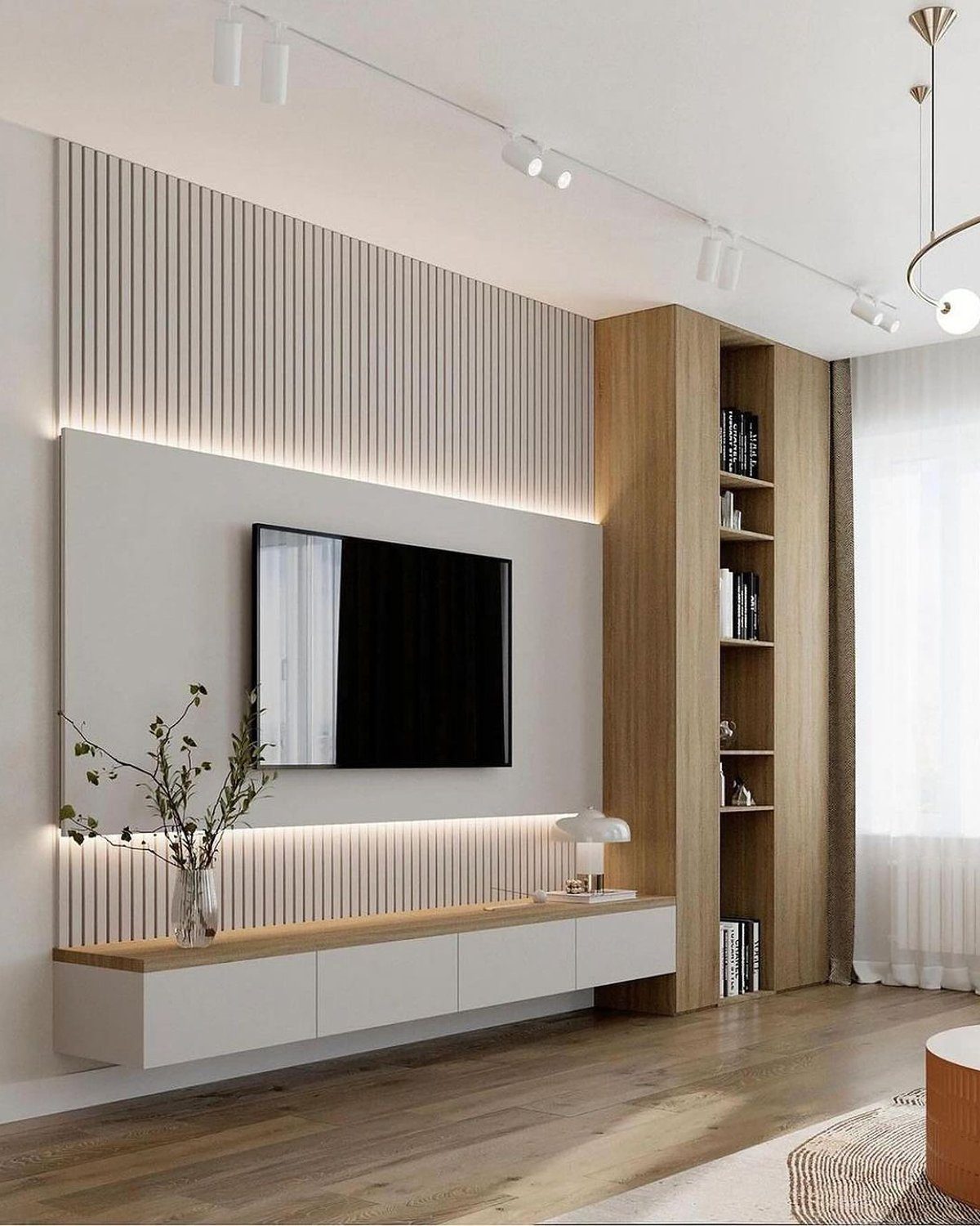 A sleek and modern living room setup featuring a wall-mounted TV