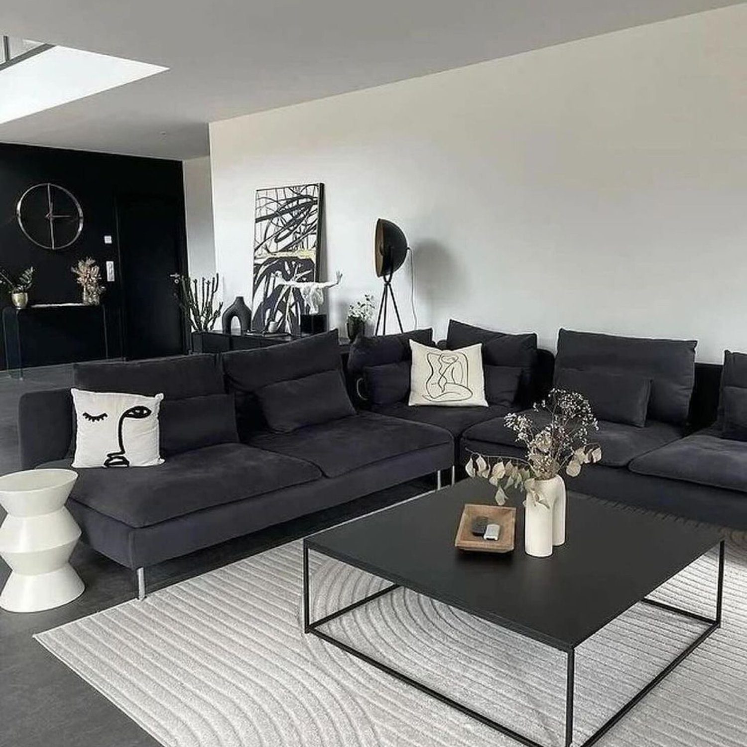 A minimalist living room with a cohesive monochromatic theme