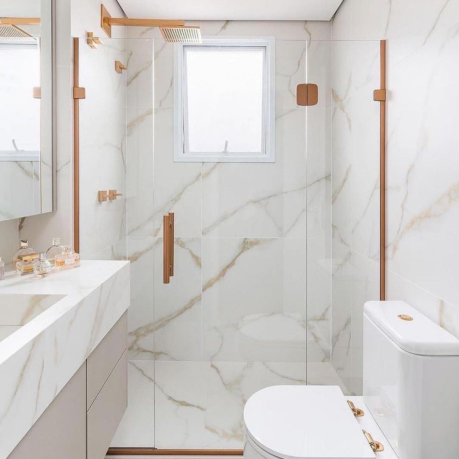 Elegant white marble bathroom with copper accents