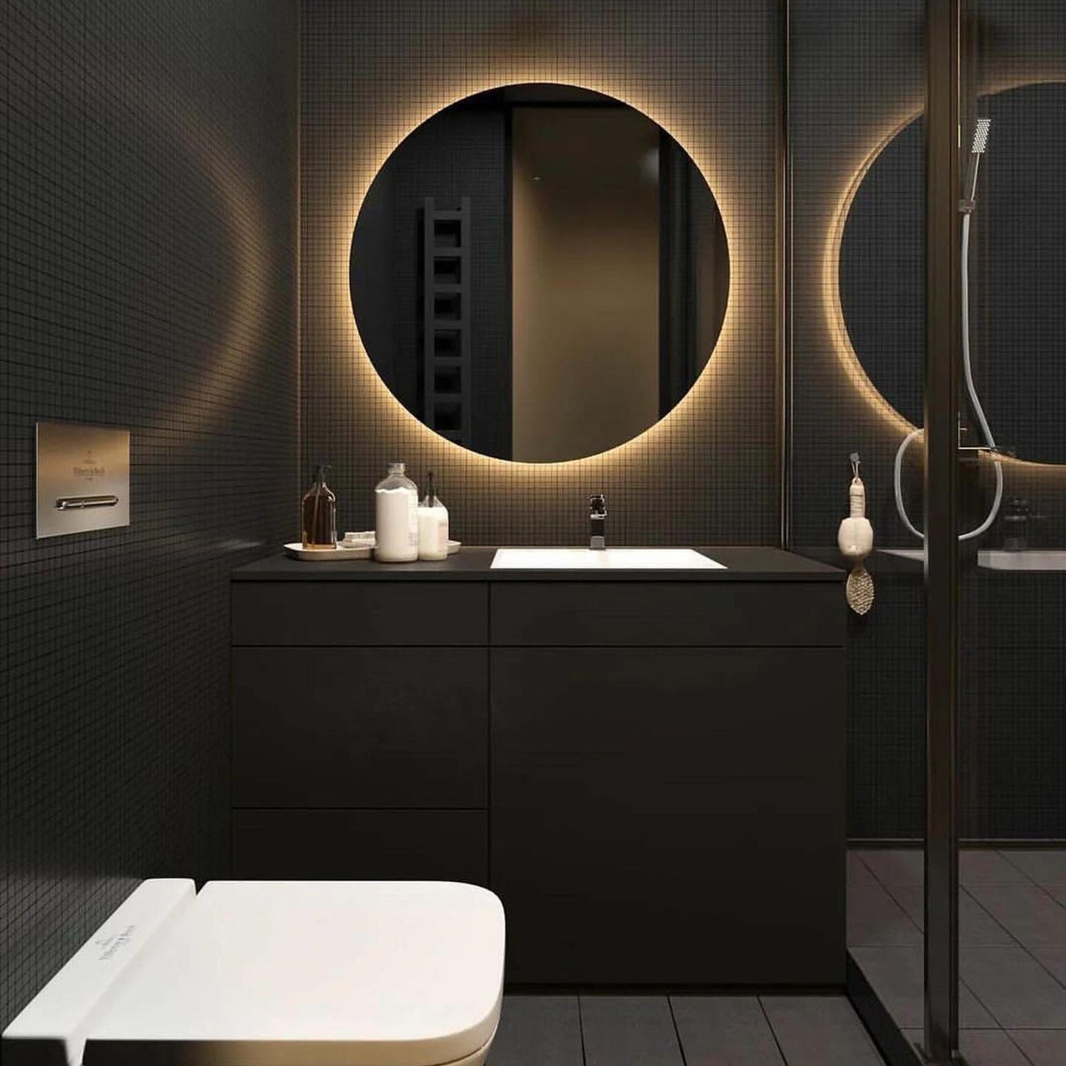 Elegant black bathroom with illuminated circle mirror