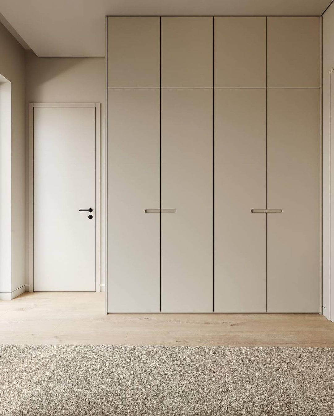 Minimalist beige wardrobe and interior door with black handles