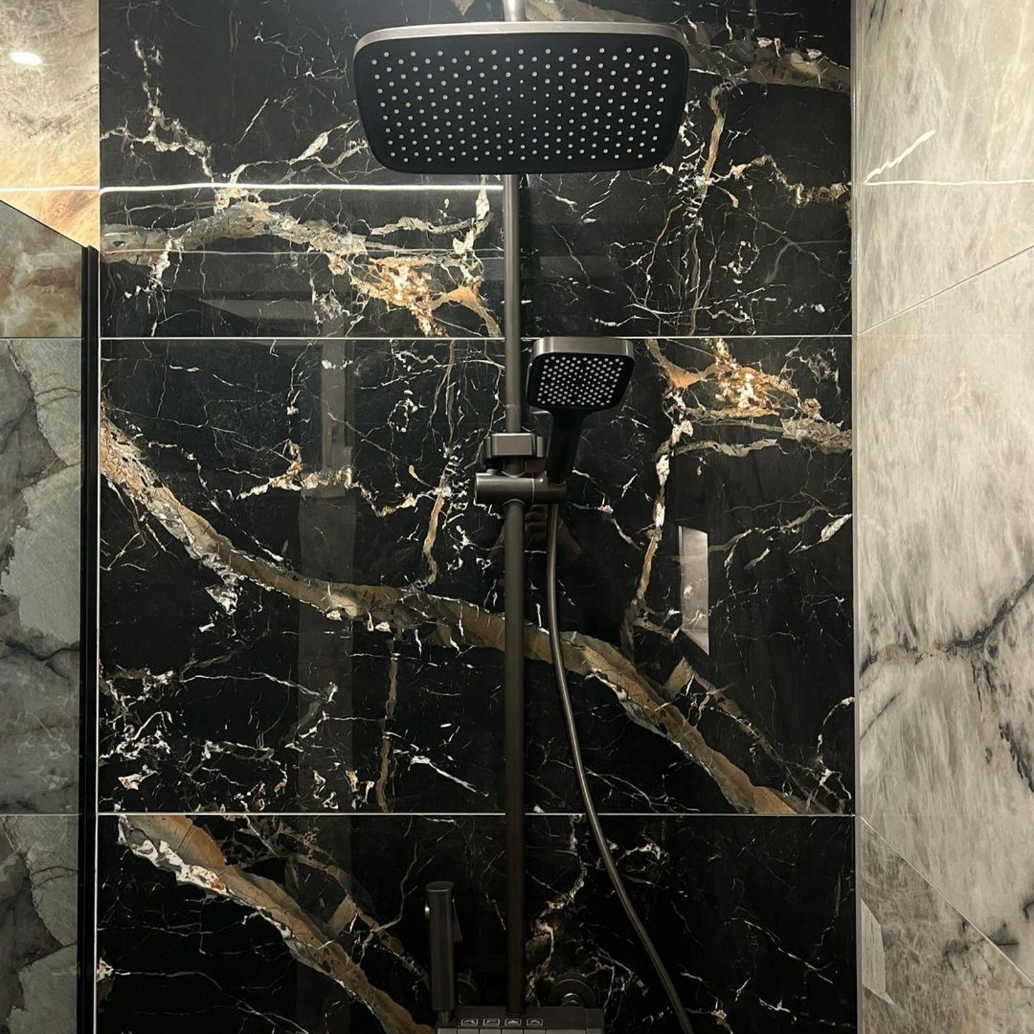 Elegant black marble shower with square rain shower head