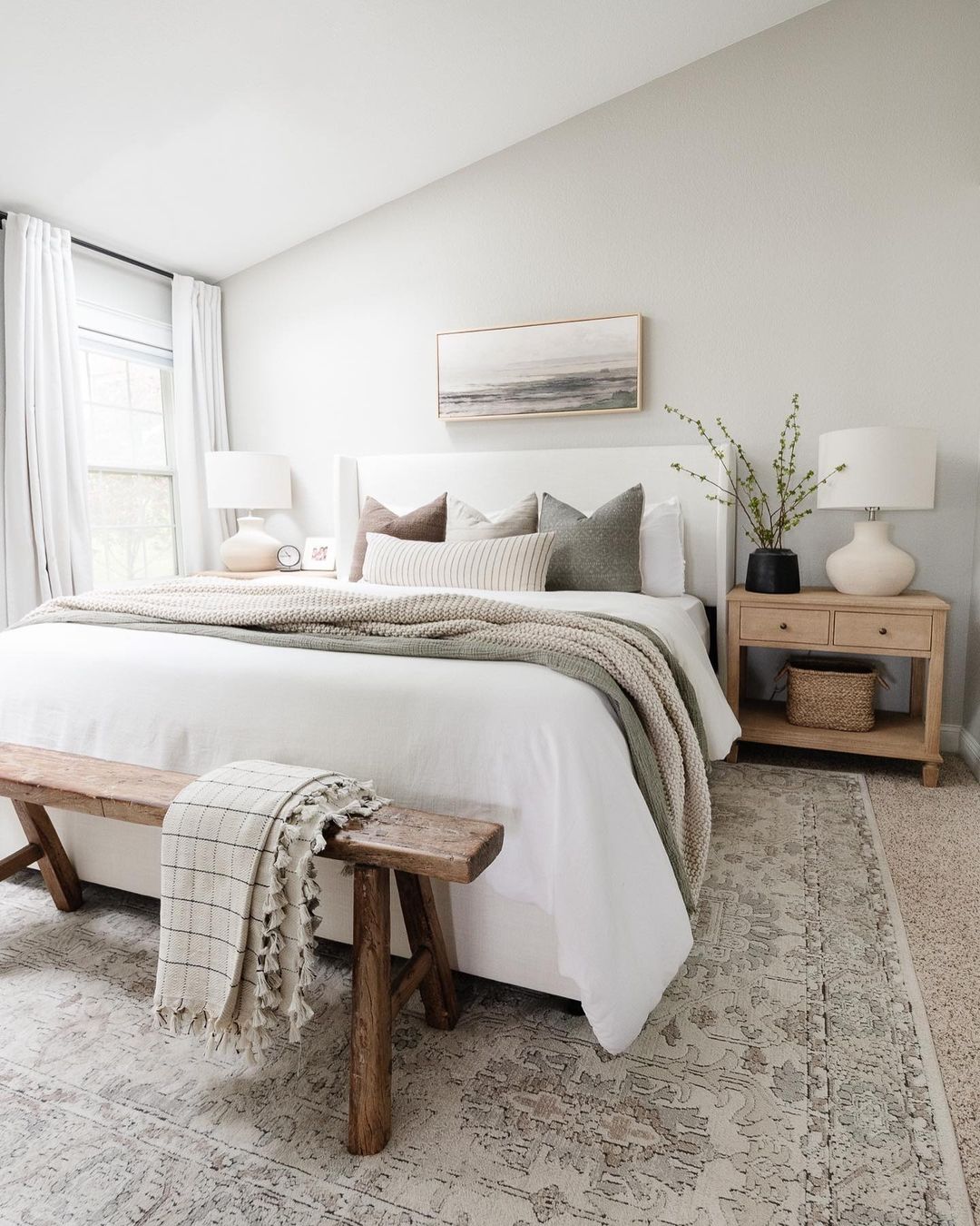 A neatly organized bedroom with a natural aesthetic