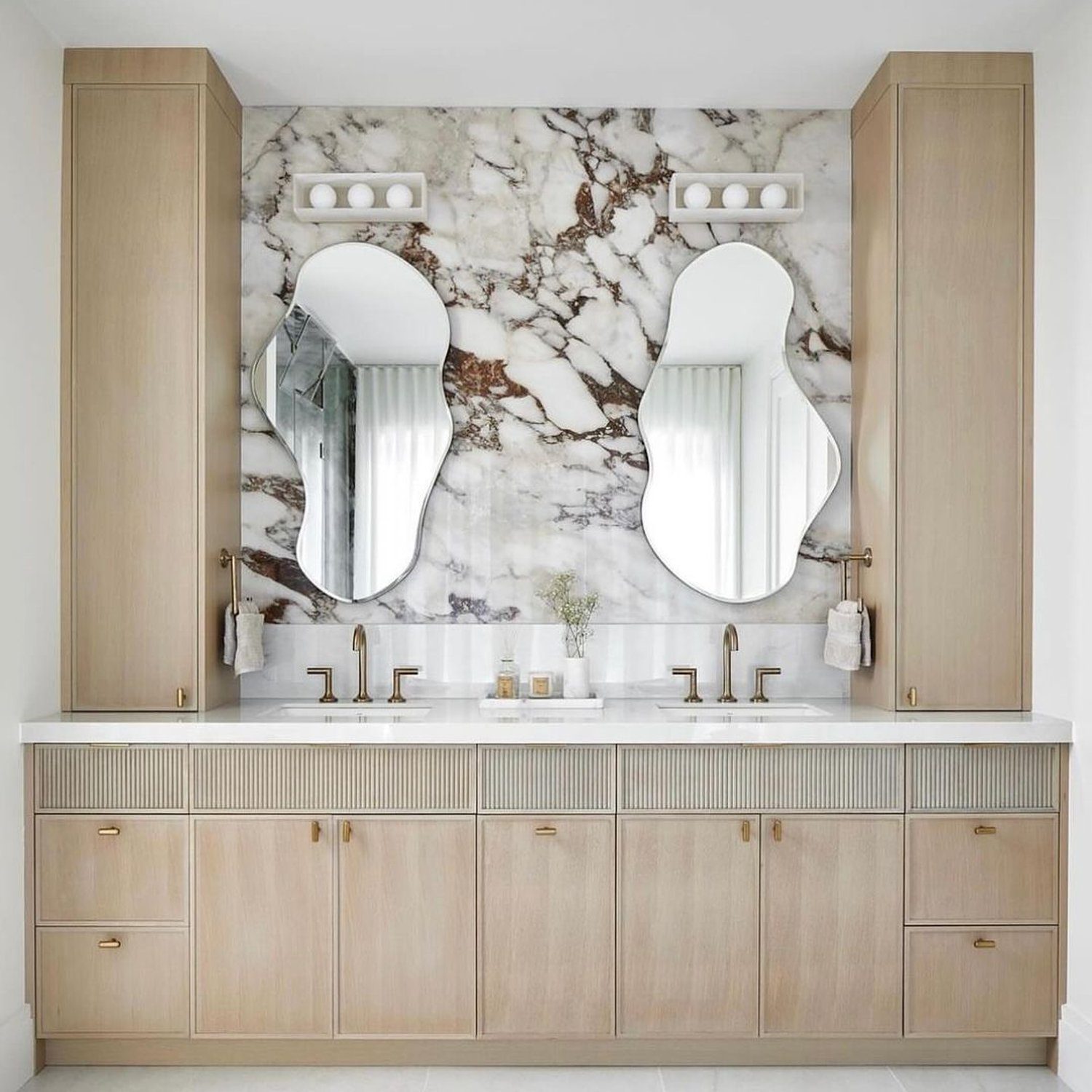 Elegant dual-sink bathroom with wood and marble accents