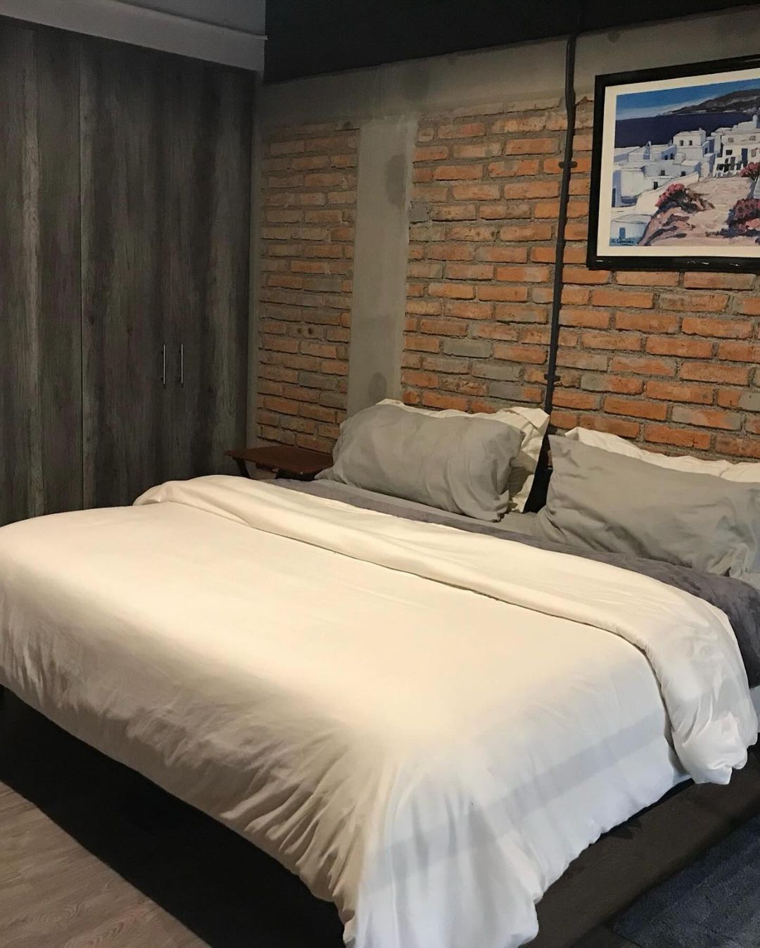 Modern Bedroom Design with Exposed Brick Wall