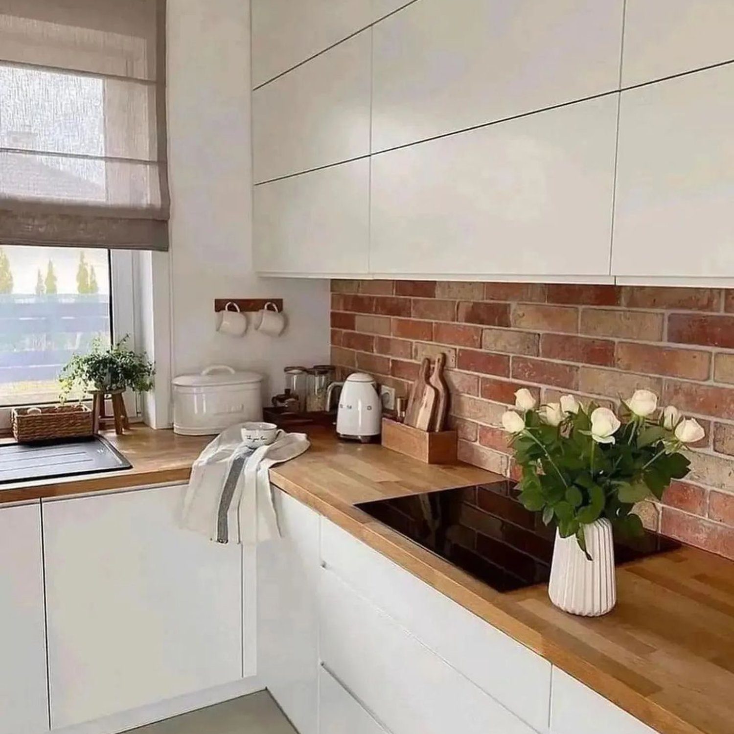 Elegant kitchen with brick backsplash