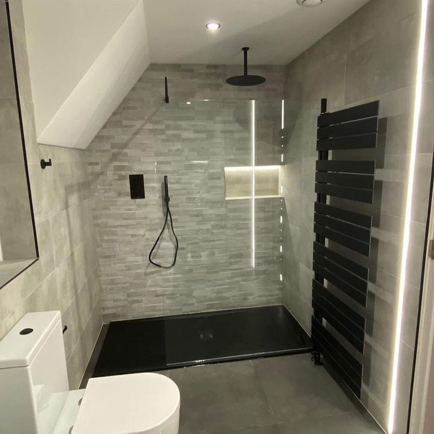 A sleek and modern bathroom design with a spacious shower area