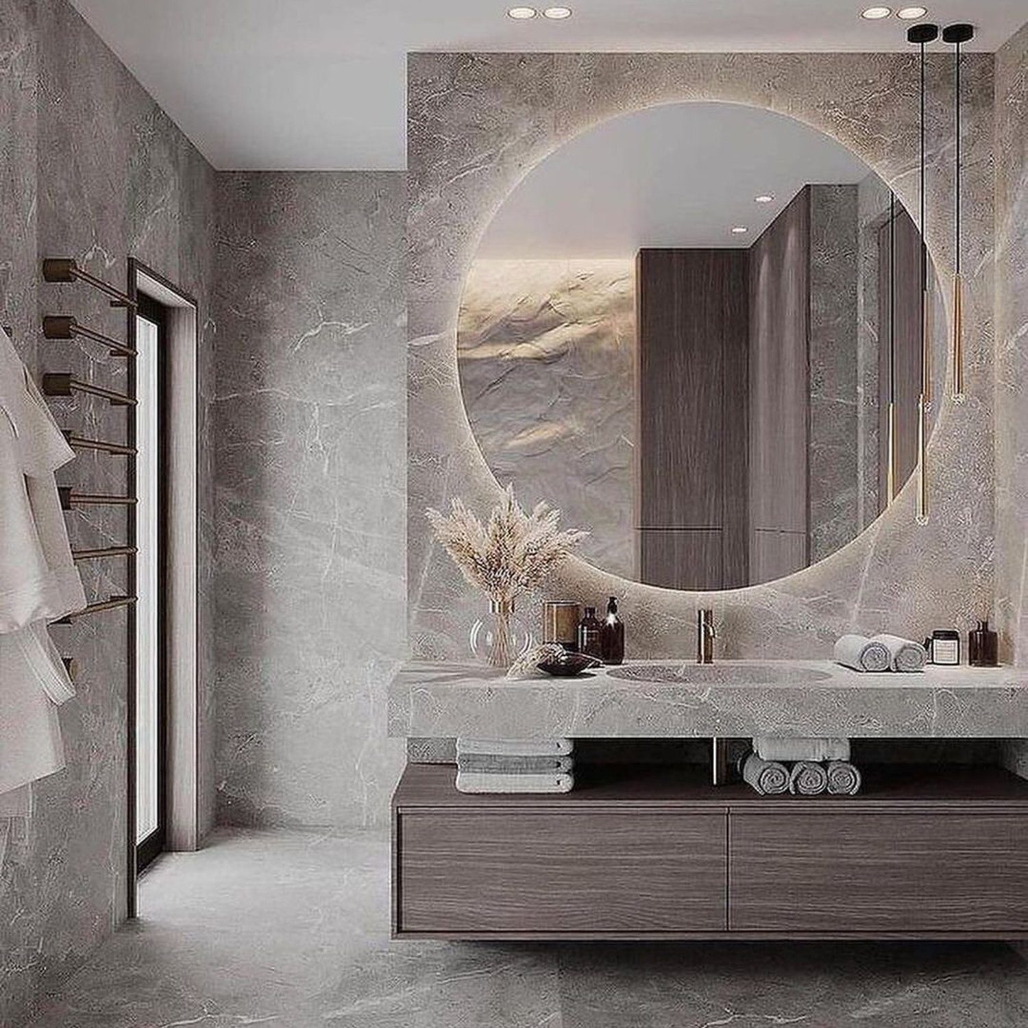 Elegant modern bathroom design with a large circular mirror and grey tones