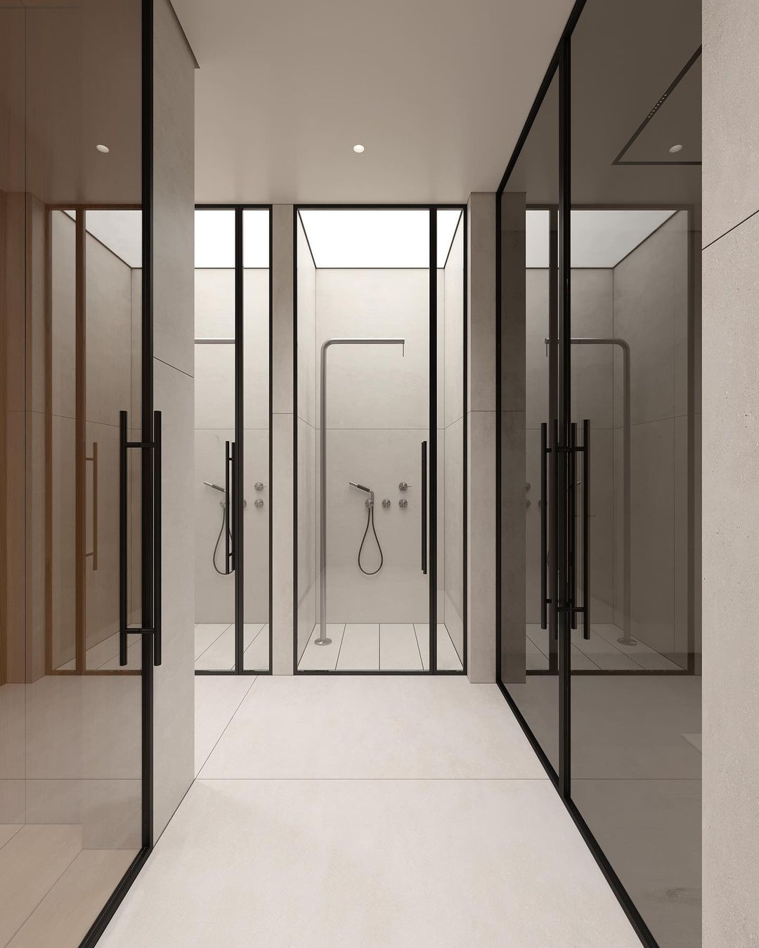 A modern bathroom featuring sleek black-framed glass doors, beige tiles, and minimalist fixtures.