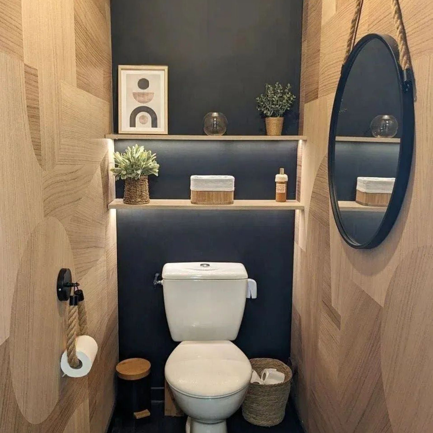 A contemporary restroom featuring wood paneling and dark accents