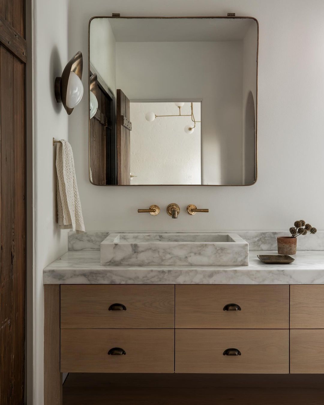 Contemporary bathroom vanity with a marble basin