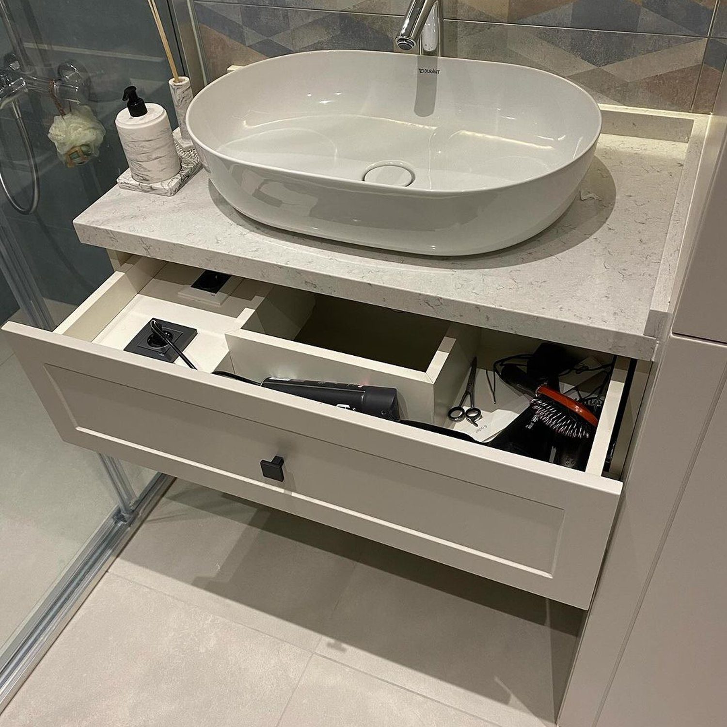 A modern bathroom vanity with organized compartments