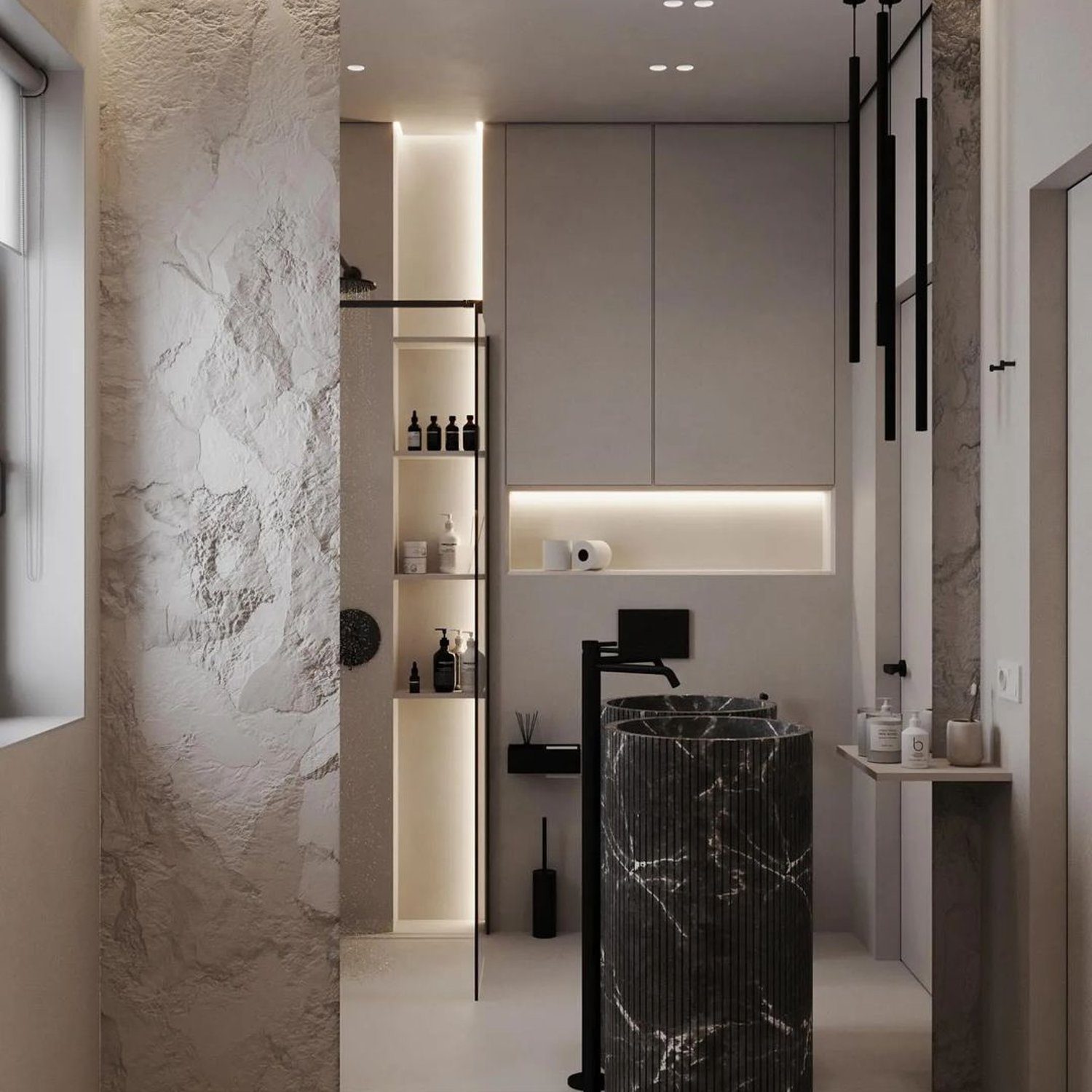 A modern bathroom featuring a striking black marble cylindrical sink