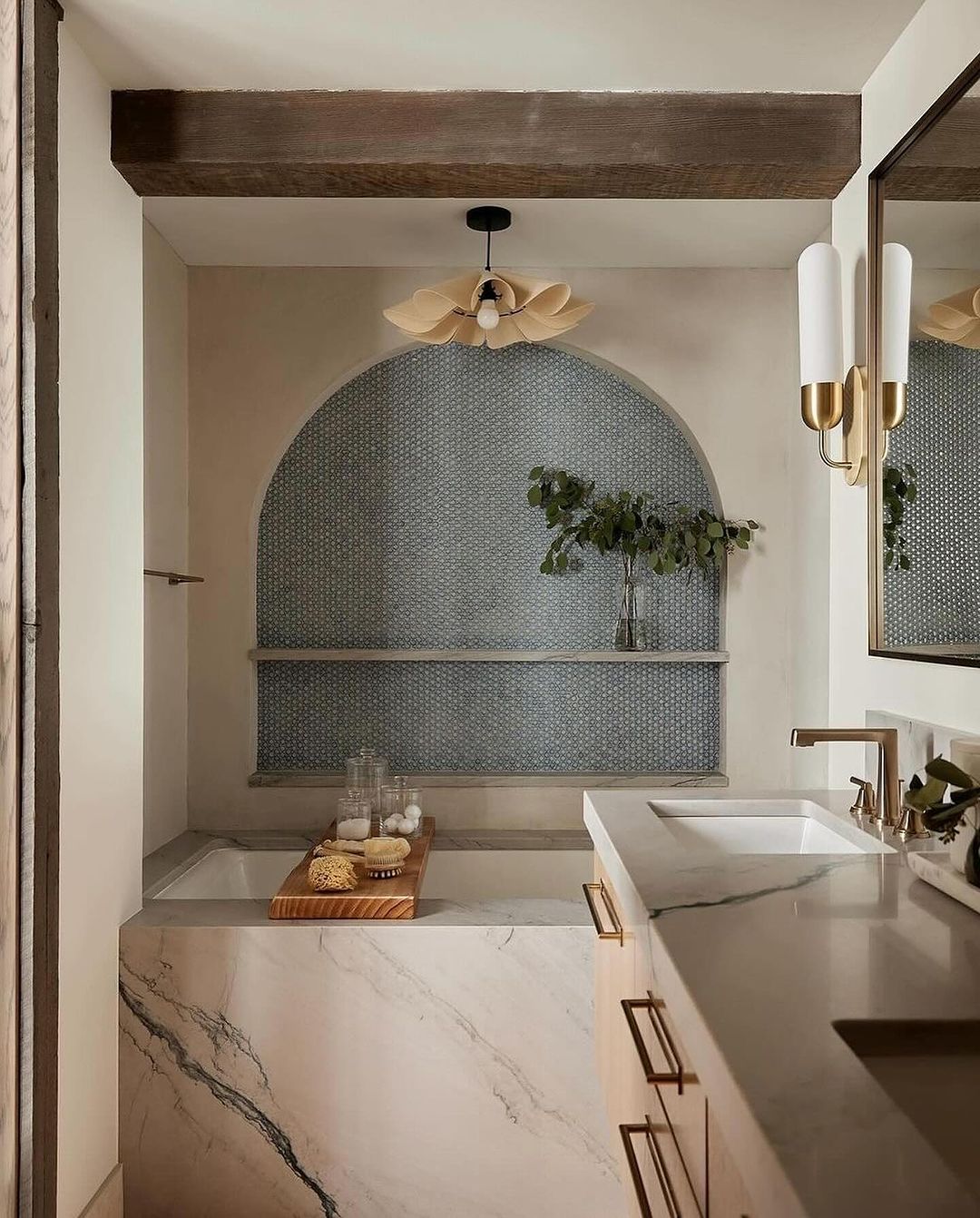 A modern bathroom with artistic touches and contrasting textures