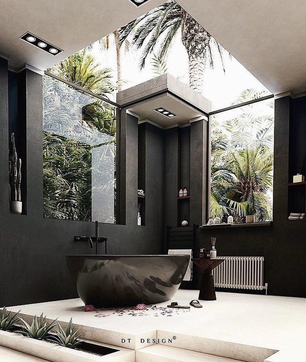 A modern, tranquil bathroom with lush outdoor views