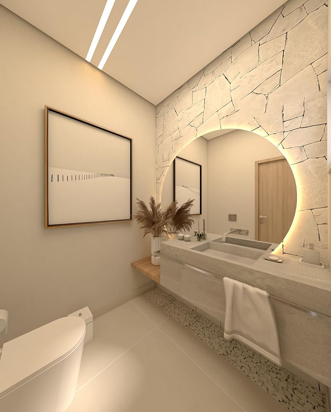 A modern bathroom showcasing a unique stone arch over the mirror and earthy tones.