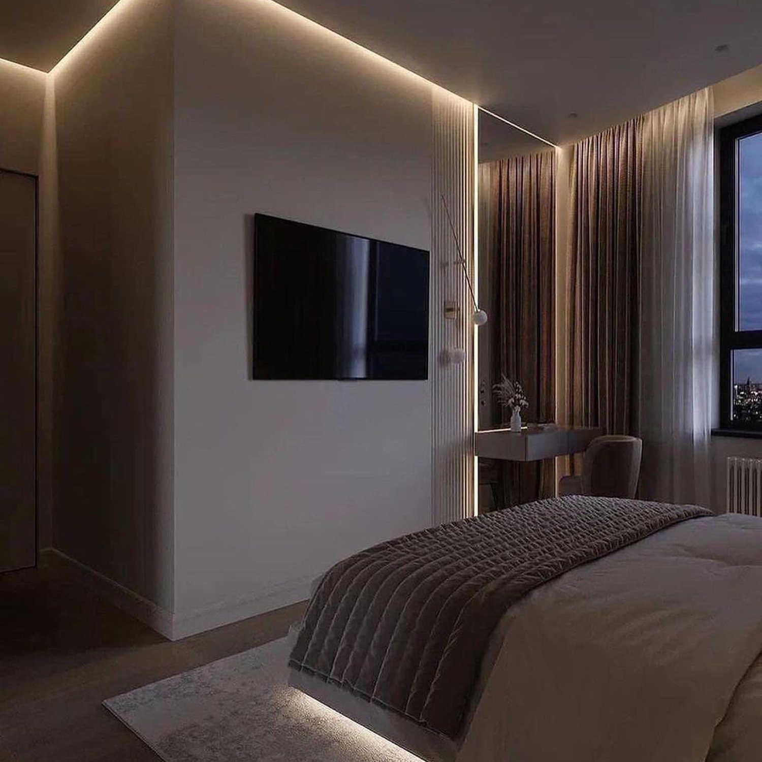 A modern bedroom with ambient lighting