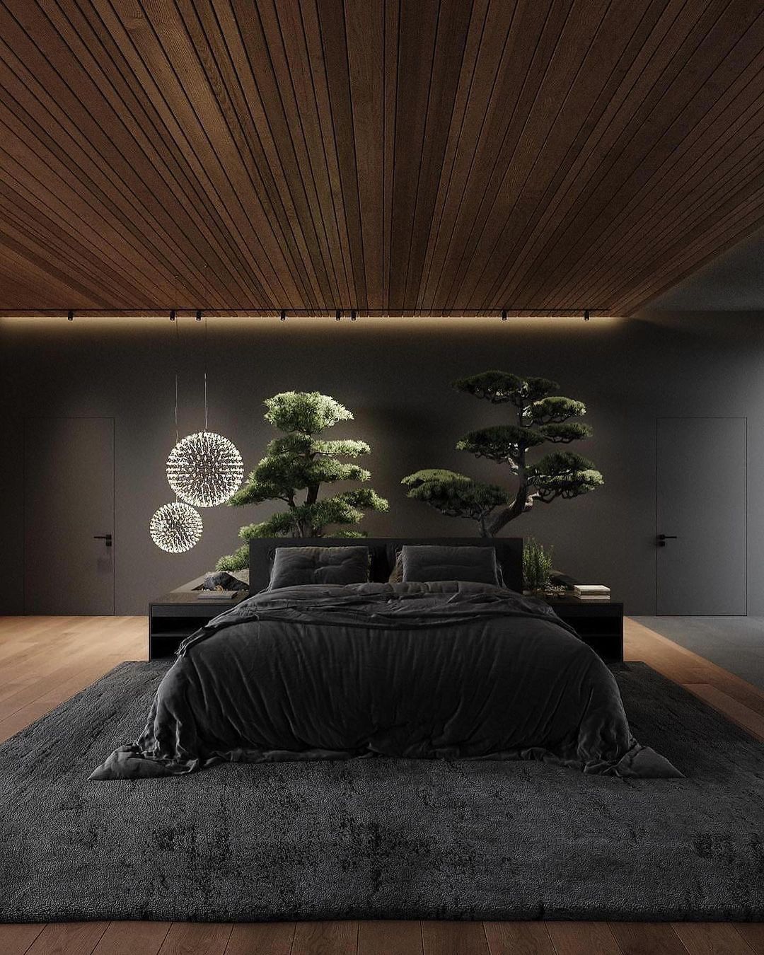 A modern bedroom featuring dark tones and natural elements