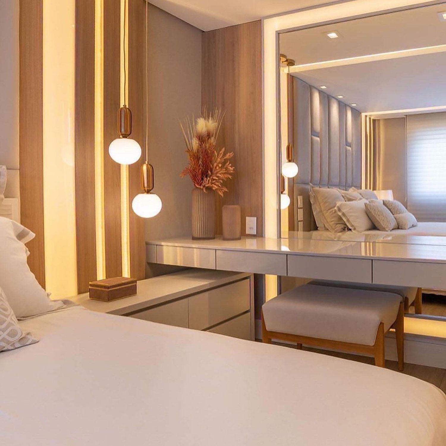 Elegantly designed bedroom with warm lighting and a comfortable ambiance