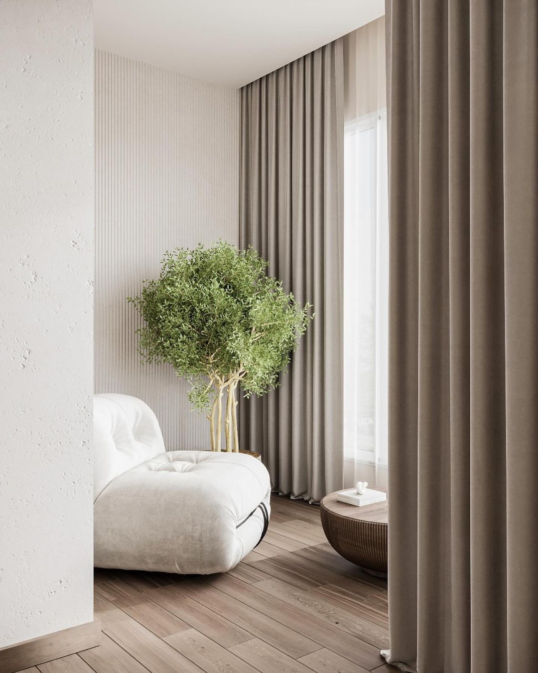 A minimalist modern bedroom with a unique spherical white couch