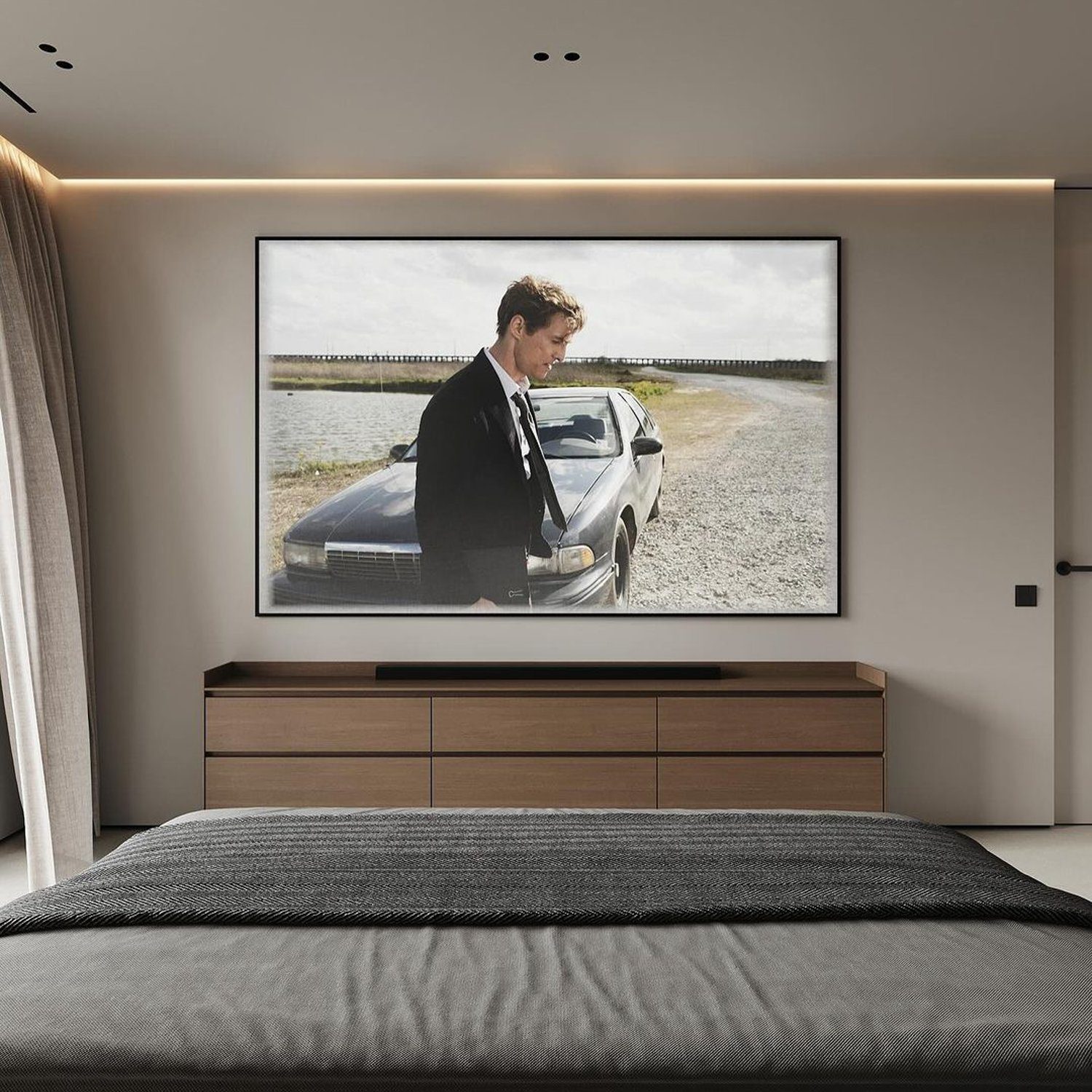 Minimalist bedroom design with wall-mounted TV displaying a scene