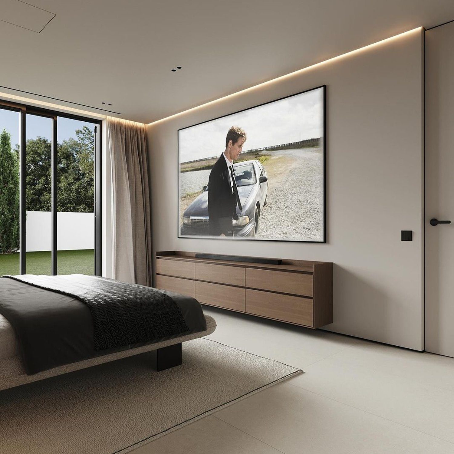 Modern minimalist bedroom with a large wall-mounted TV