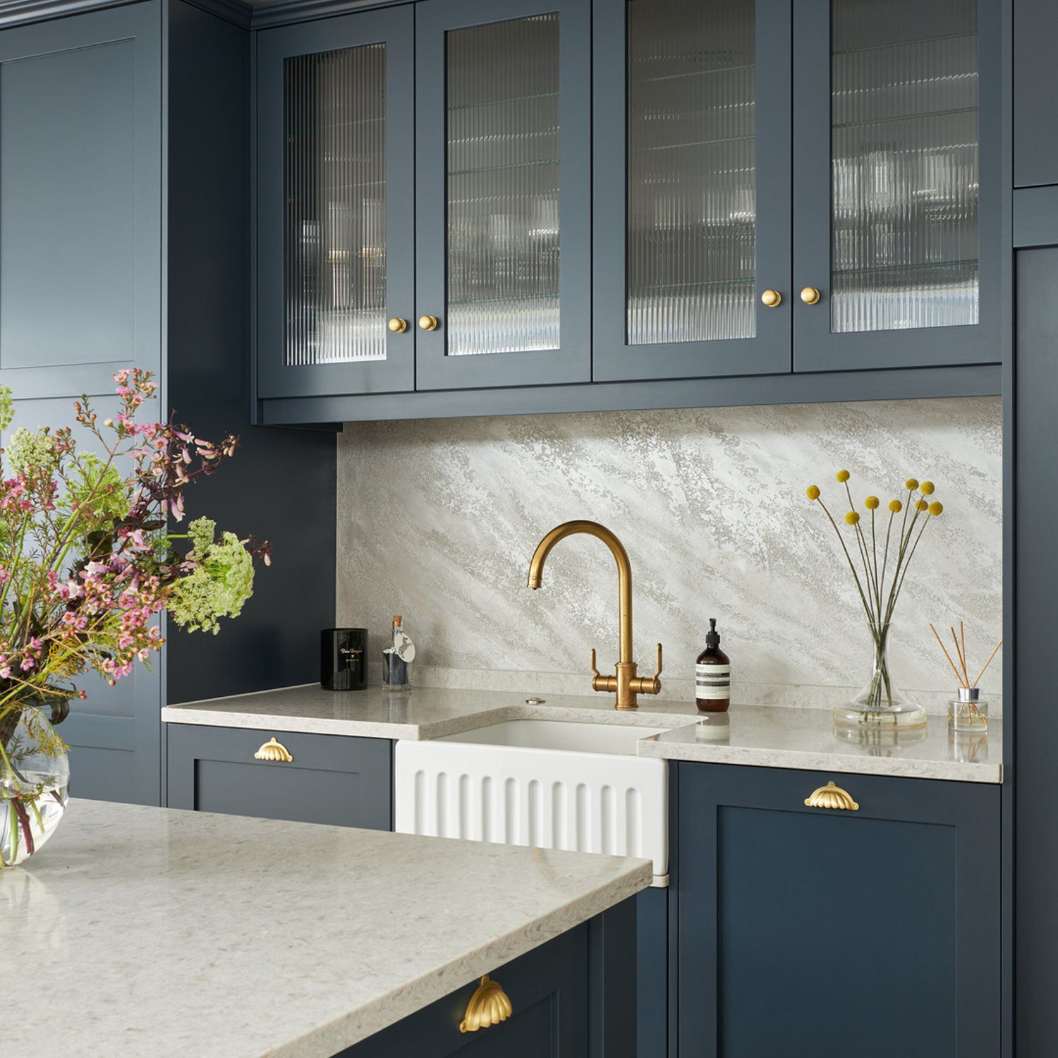 Elegant modern kitchen with blue cabinetry