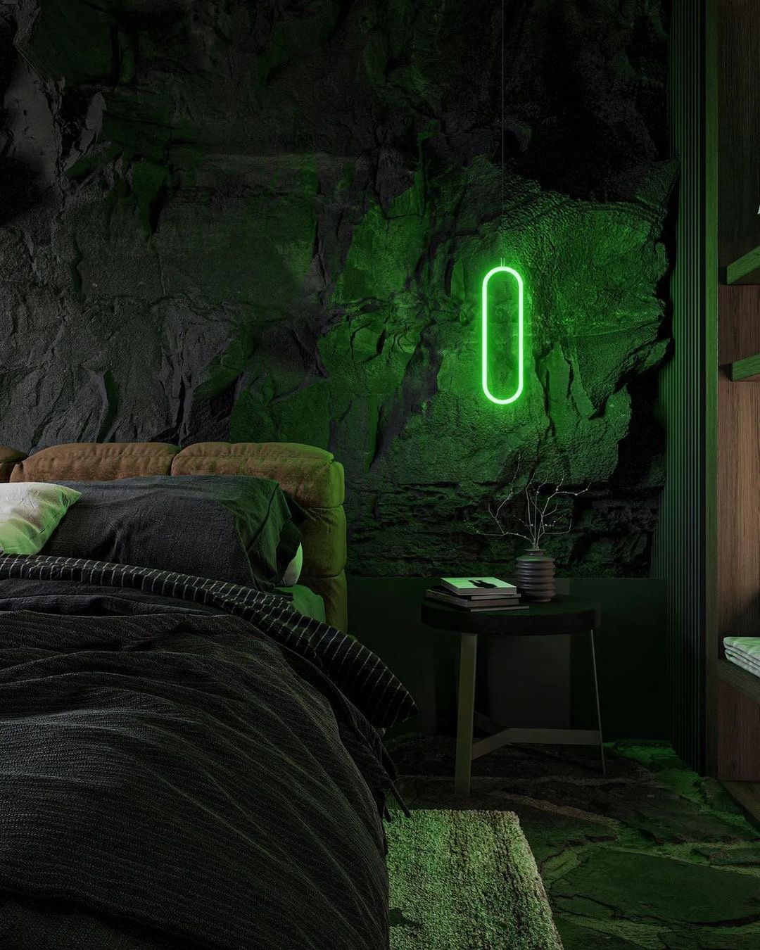 A unique bedroom with rugged rock walls and a glowing green pendant light