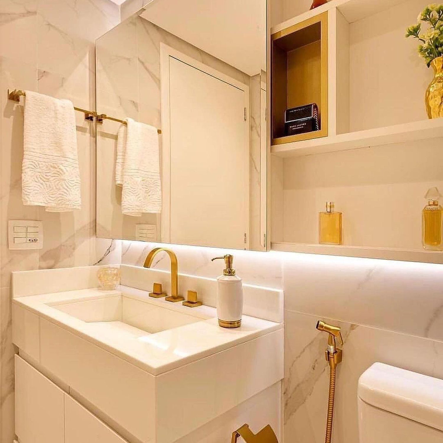 Elegantly designed white and gold bathroom