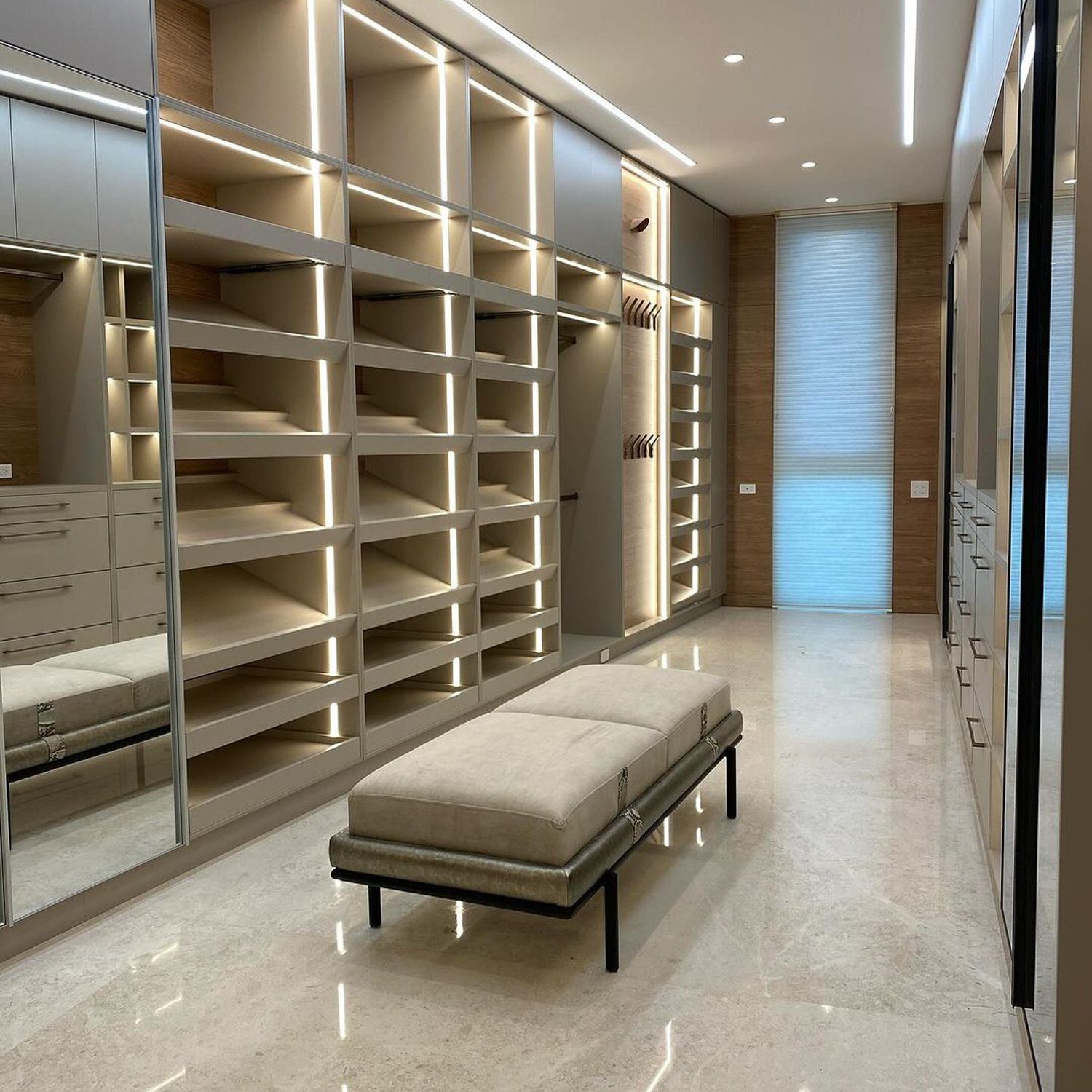 A meticulously designed modern closet with integrated lighting