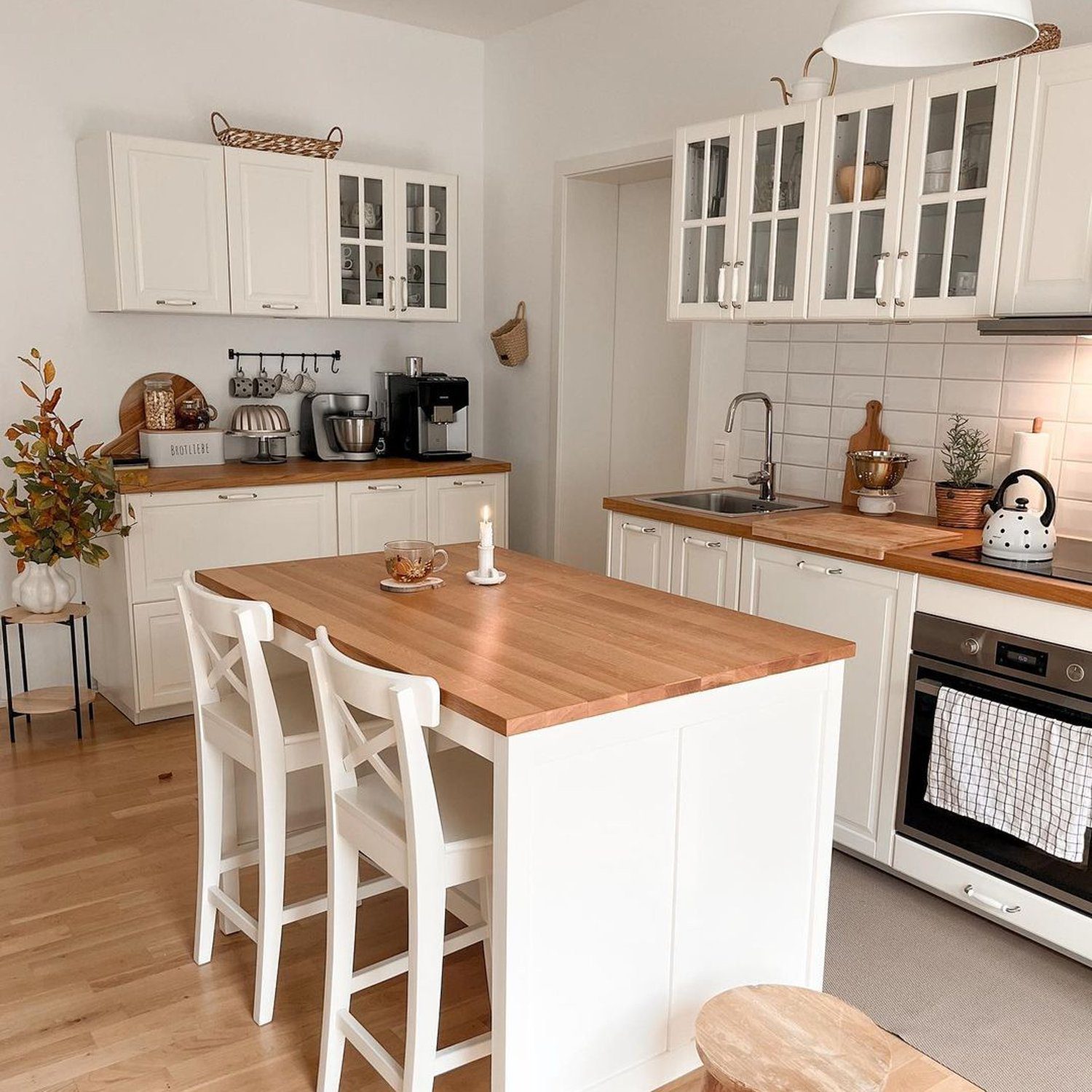 A cozy kitchen space with modern amenities and a warm wooden touch