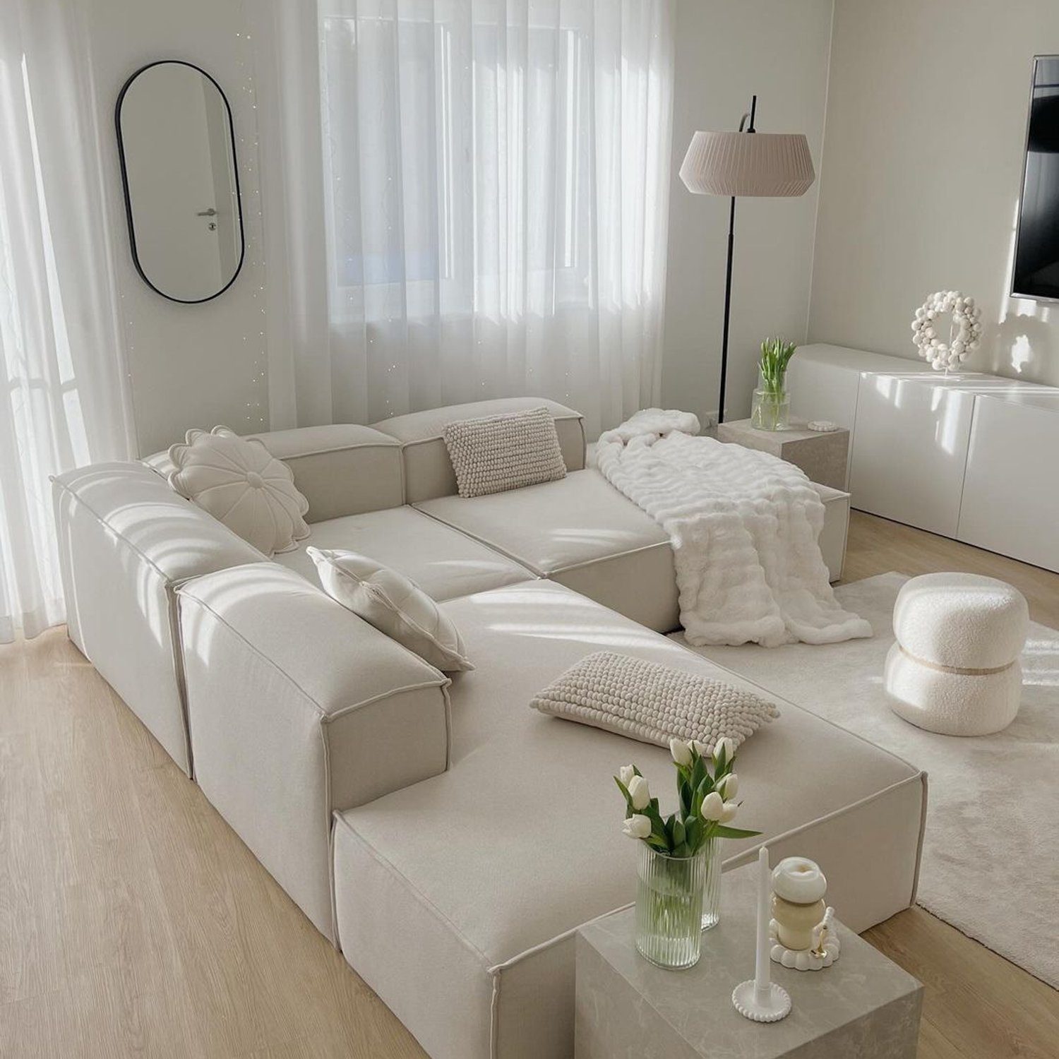 A modern living area with a cohesive cream palette