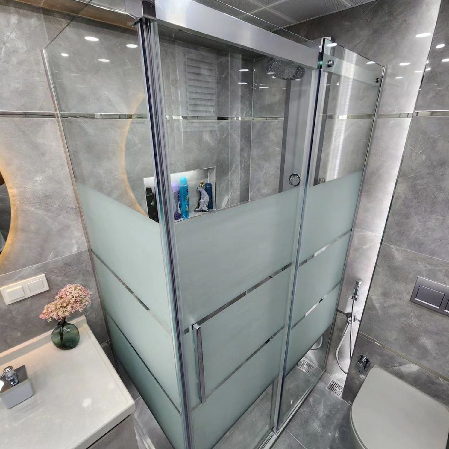 Elegant and modern bathroom with curved glass shower stall