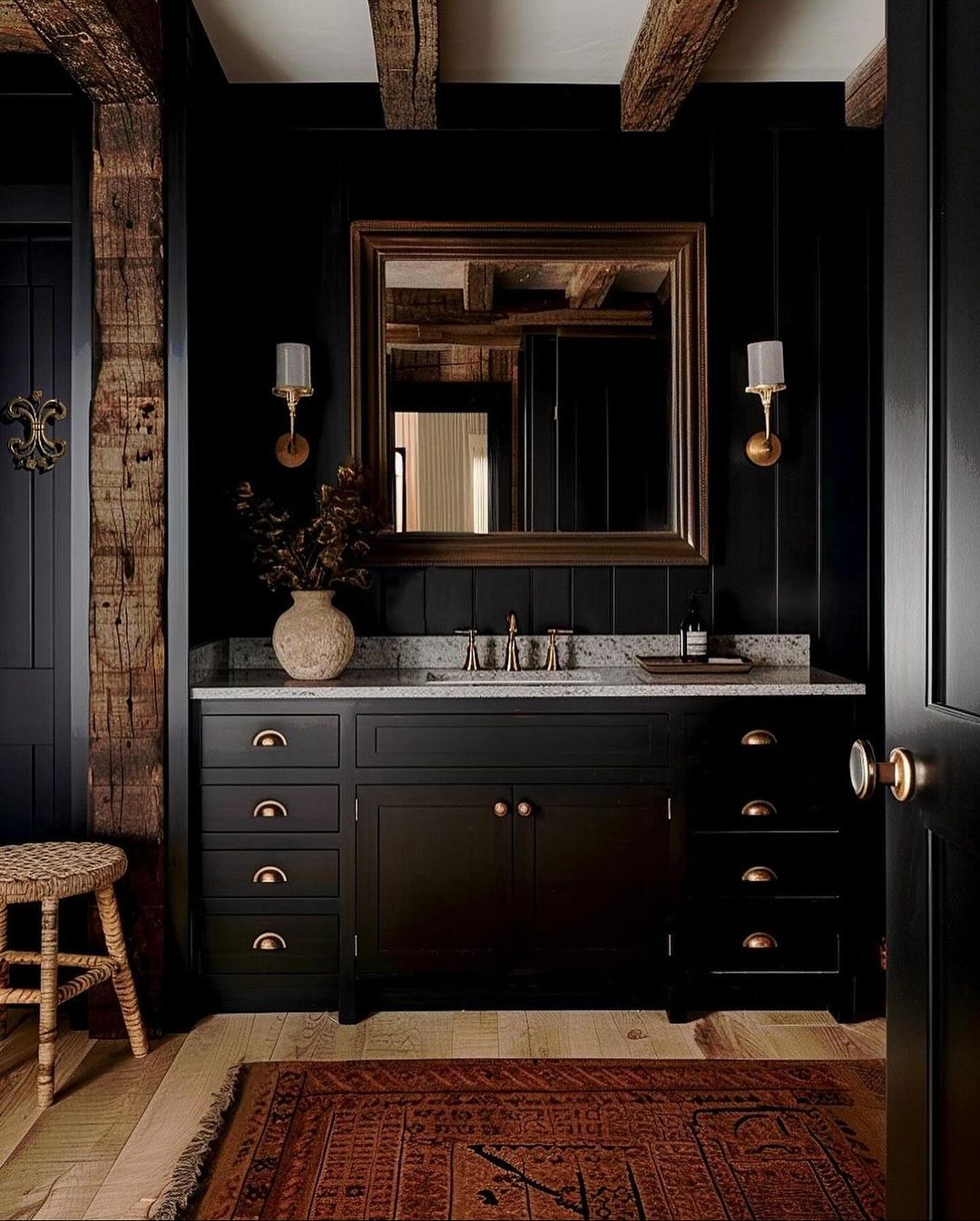 A chic bathroom featuring striking contrast with dark cabinetry and natural wood accents.