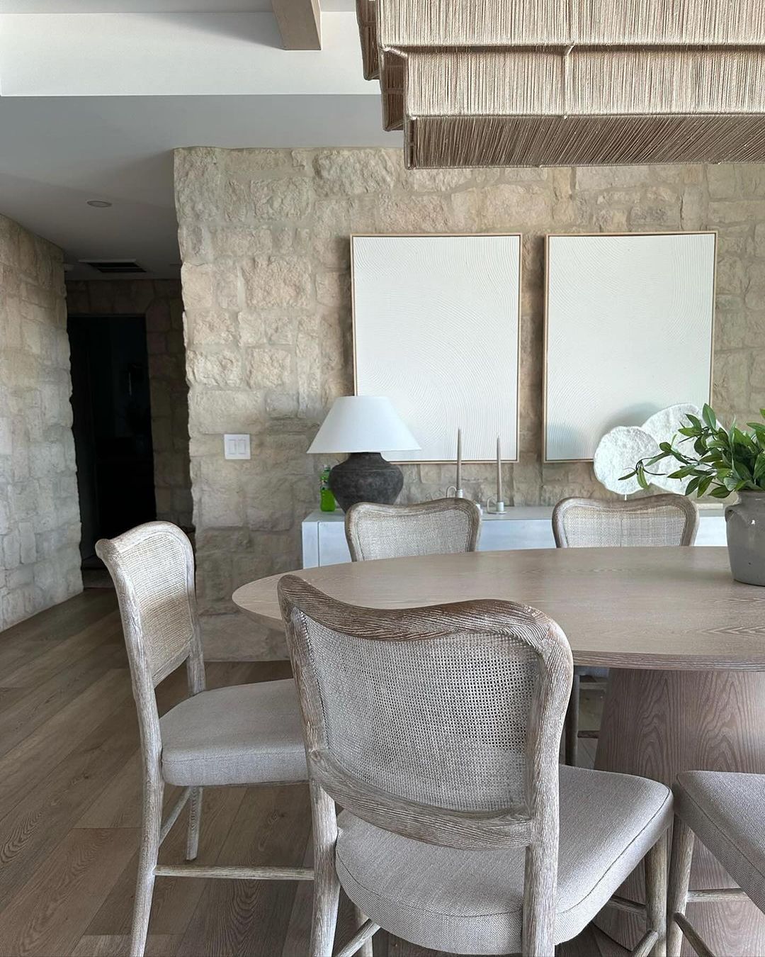 A tastefully designed dining space featuring natural textures and serene tones